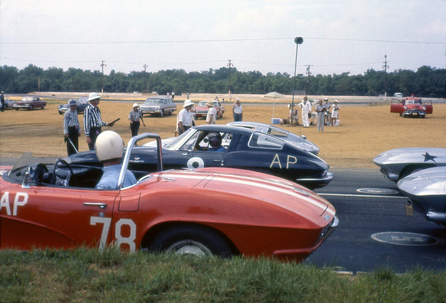 Marty Krimmer in the red #78 and Paul Sykes in the black coupe both look to the starter.