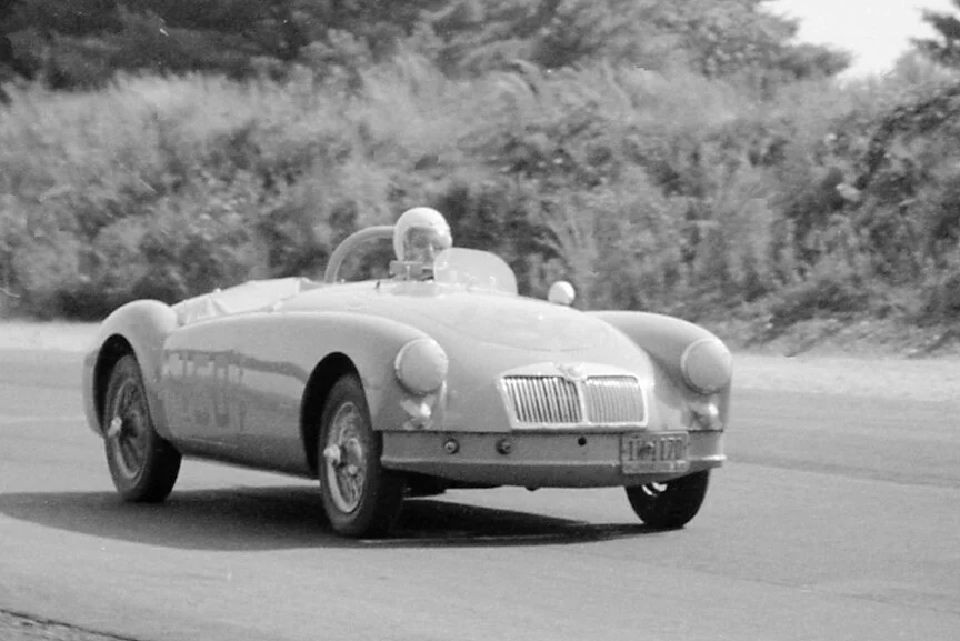 BARC member Bob Poupard in his first race car, the blue 1500cc MGA. Poupard did better on Monday and was 2nd MGA. MG’s were completely outclassed by the 4 cam Porsche Carerra’s who also raced in FP because their engines were the same size as the MG.