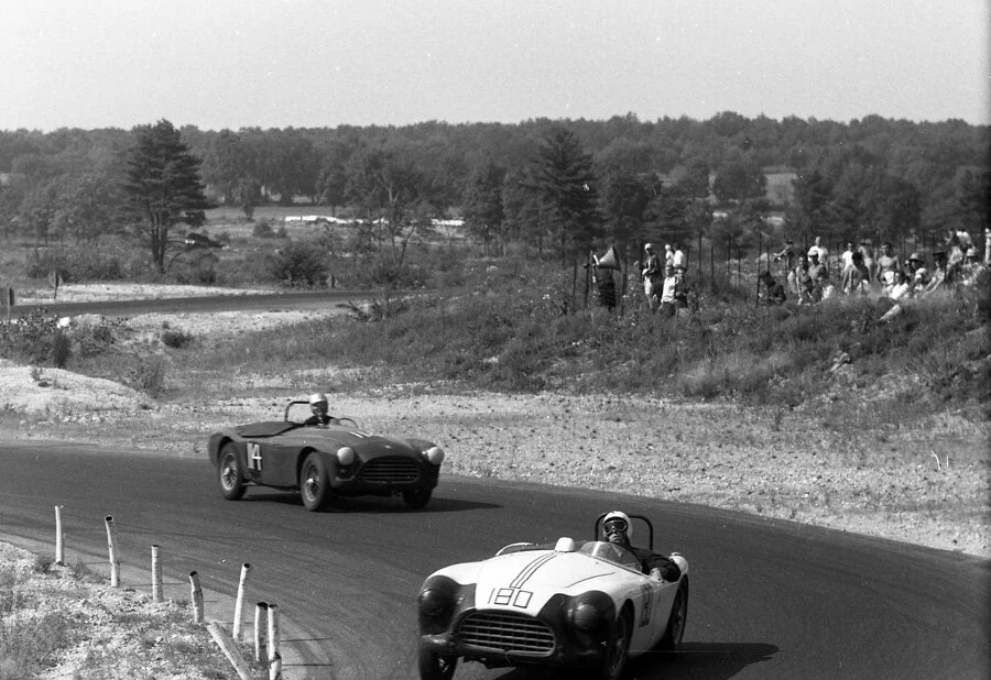 Harry Carter sometimes drove with his arm on the door locking himself in place. Here is a great example of that style while winning DP. He leads Bob Petit’s #114 AC Bristol.