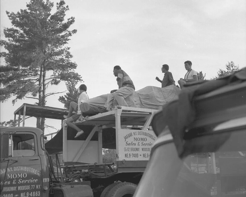 High atop the Momo Corp car carrier, BARCBOYS Joe Tierno and John Kelley (both at rear) enjoy an unrestricted view of he track.
