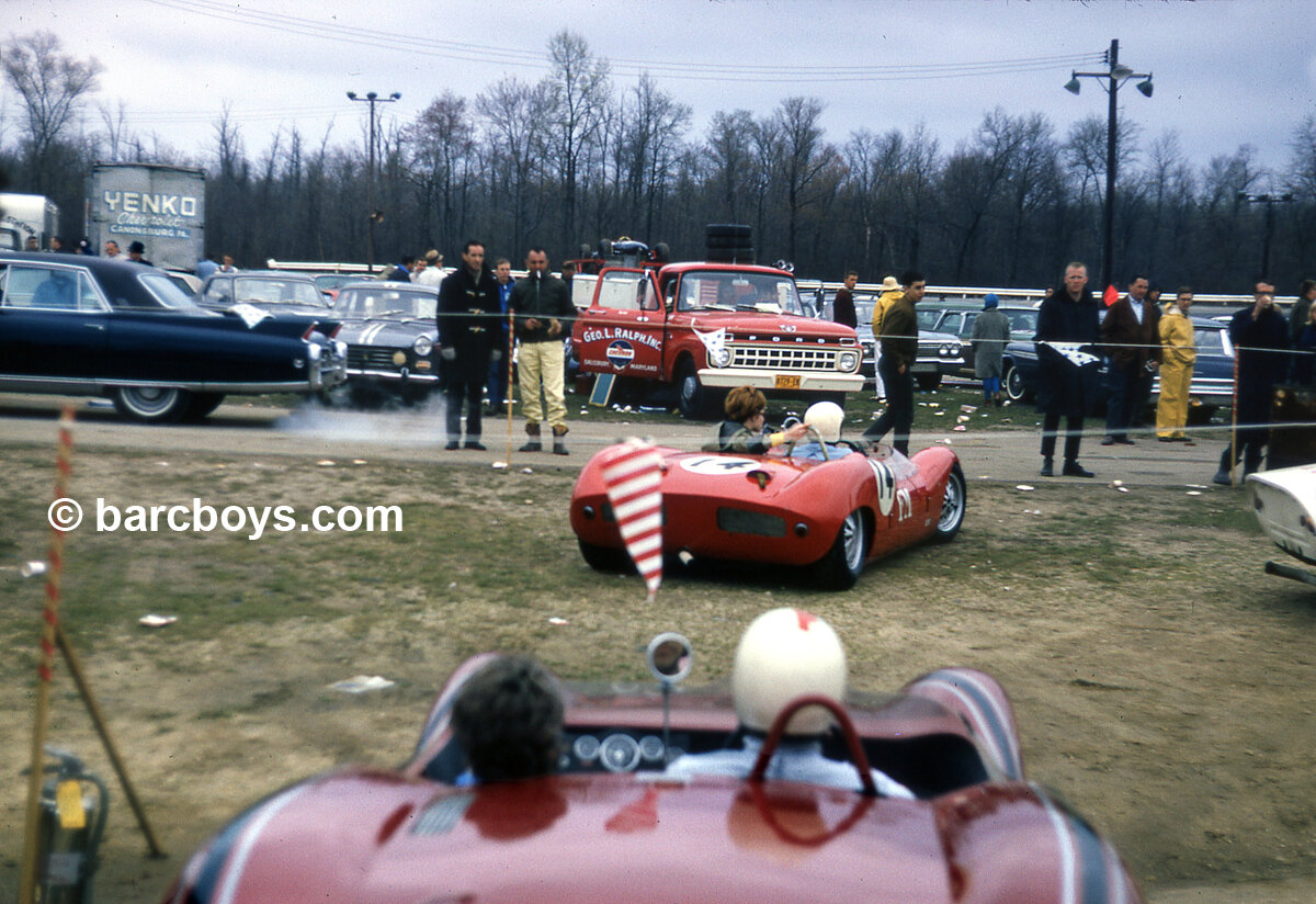  Alan Friedland #14 with Phyllis heads back to the paddock after the race.  He is followed by Warren Shamlian’s Elva that won G Modified. 