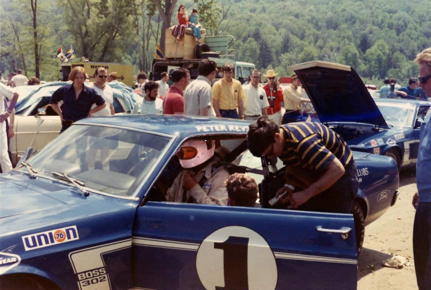  A color shot by Greg Rickes of Posey being situated in the Team Shelby Mustang. 