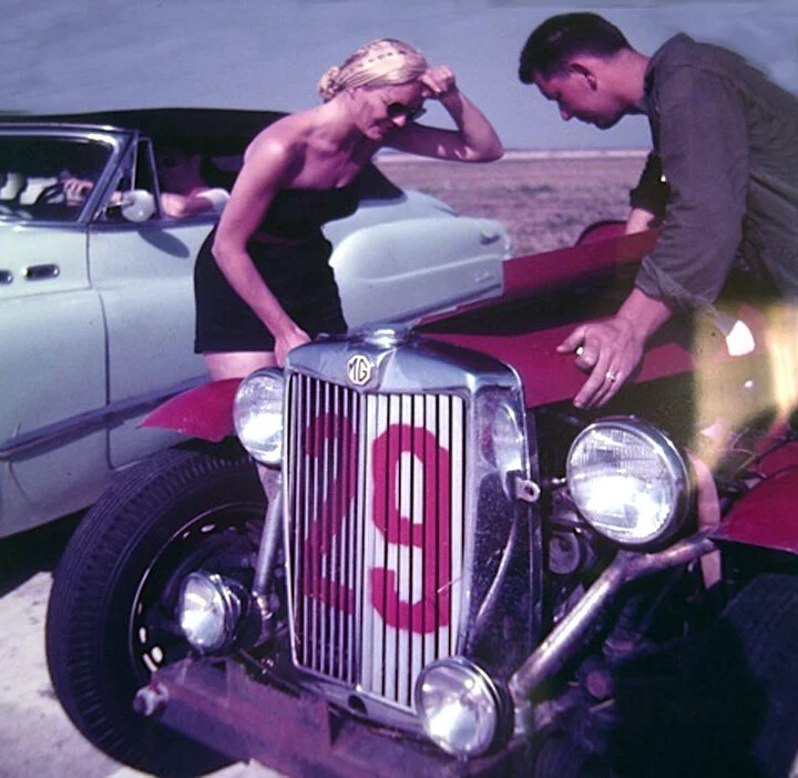 Our blonde pit crew looks a bit befuddled as the bonnet is being put back in place.