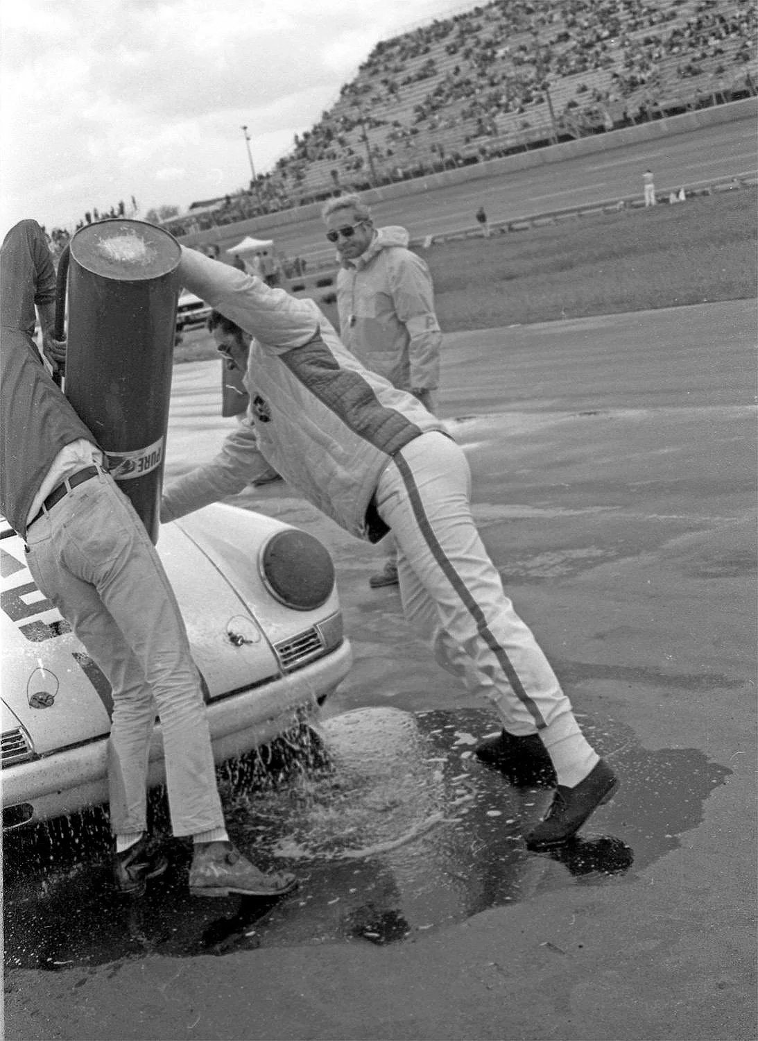  Gregg’s crew hoisting a very heavy fuel dump can.  Very typical of refueling in 1969.  Gas spilled everywhere making sure the tank was full.  Aircraft dry release appeared two years later. 