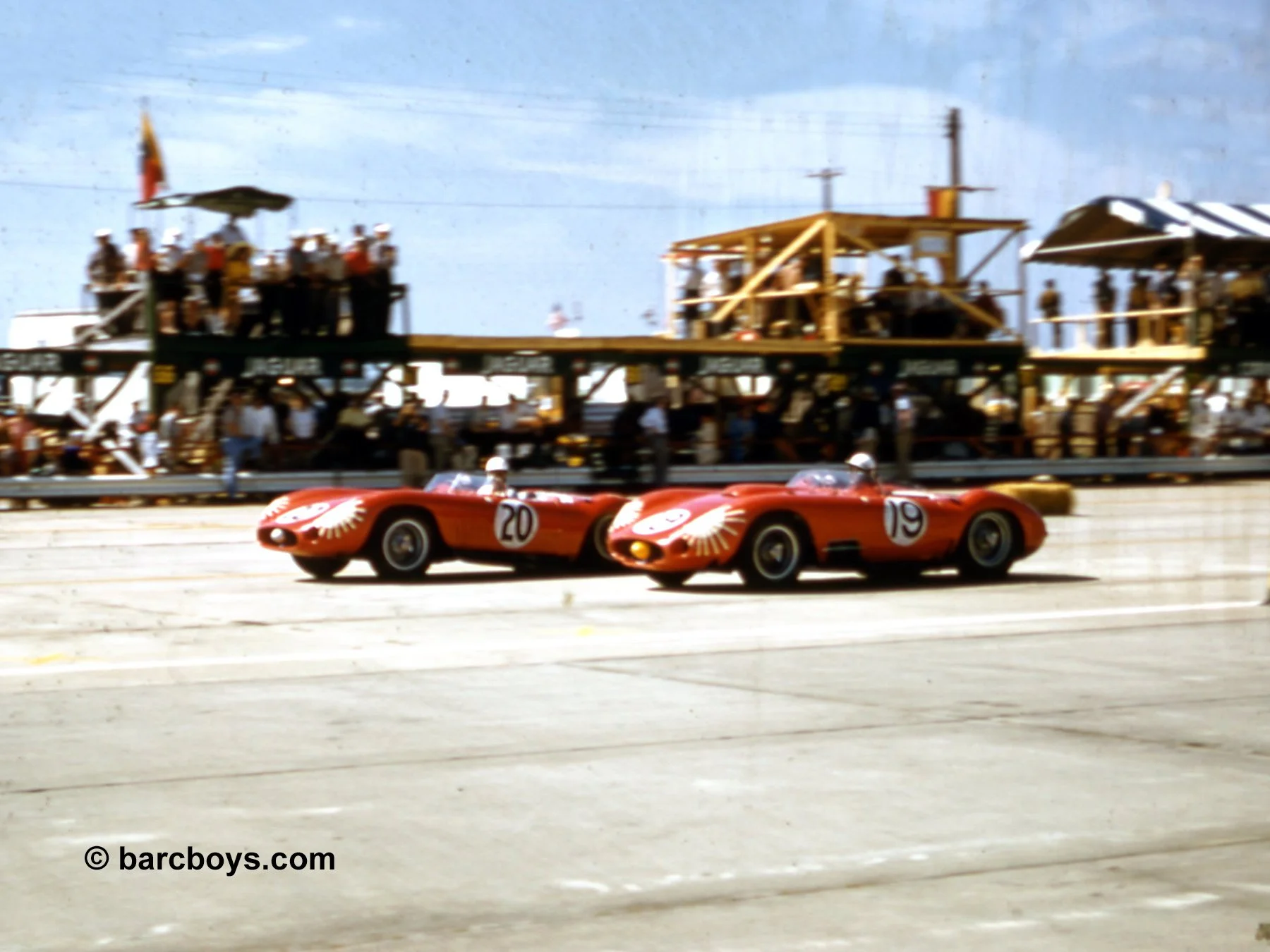  Who says drivers don’t have fun. Stirling Moss looks over as Jean Behra in the big 4.5 passes.  Behra, with Fangio would win, Moss with Harry Schell finished 2nd. 
