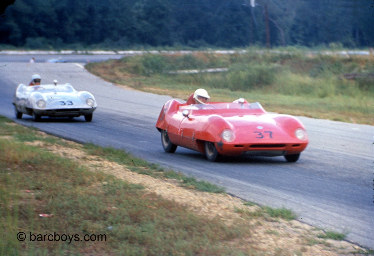  Art Tweedale’s Elva MkIV has jumped off the oval and leads another Elva.  Tweedale finished 2nd in April but won the Marlboro 6 hour later in the year. 