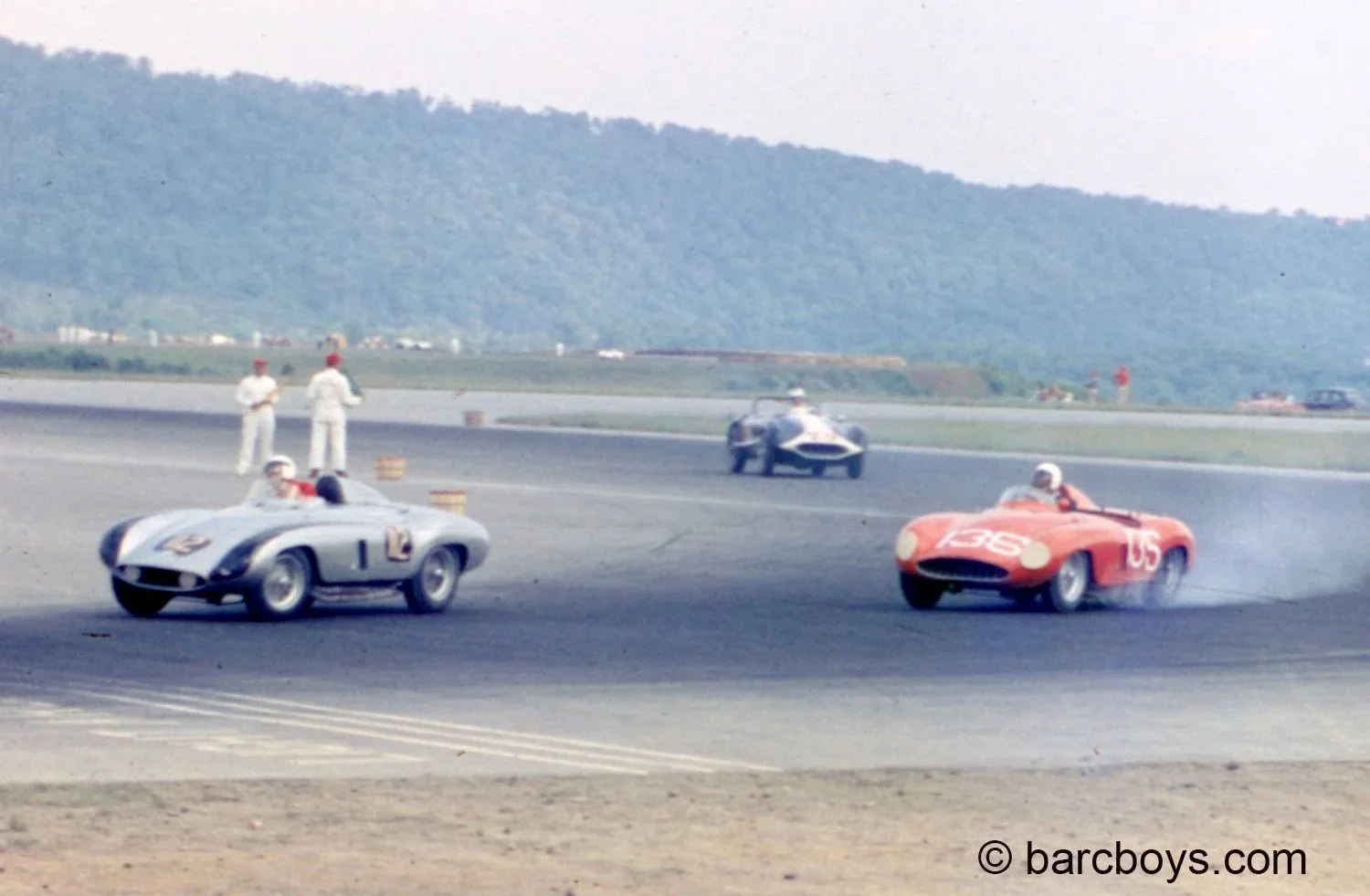  Don Peters in the silver Ferrari leads Ed Gelders Ferrari Monza.  Gelder appears to have locked up his brakes.  Don Peters had only one arm yet was very quick. 
