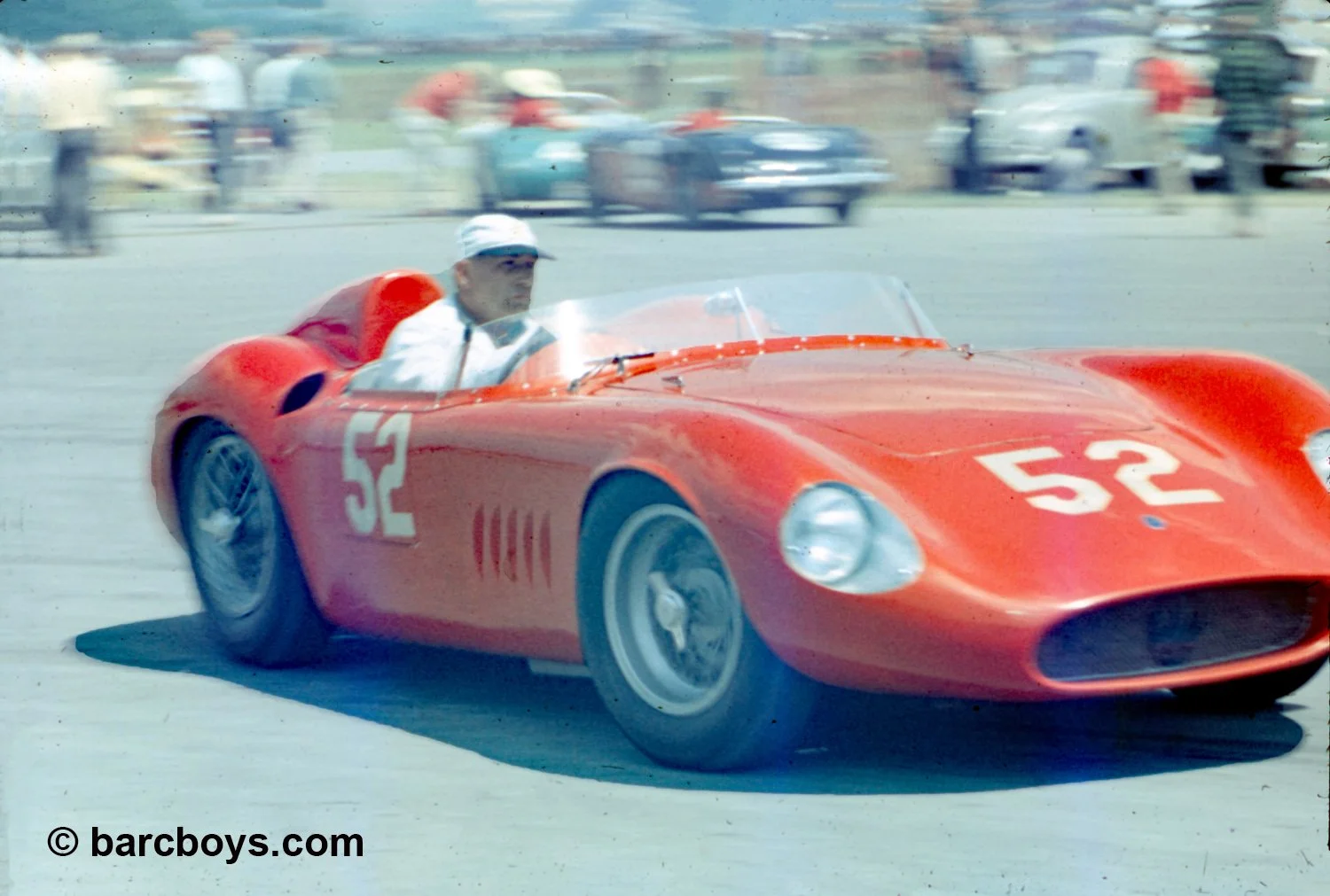  The guy driving John Cook’s Maserati 300S doesn’t look too happy.  The results might show why as Cook did not finish the race. 