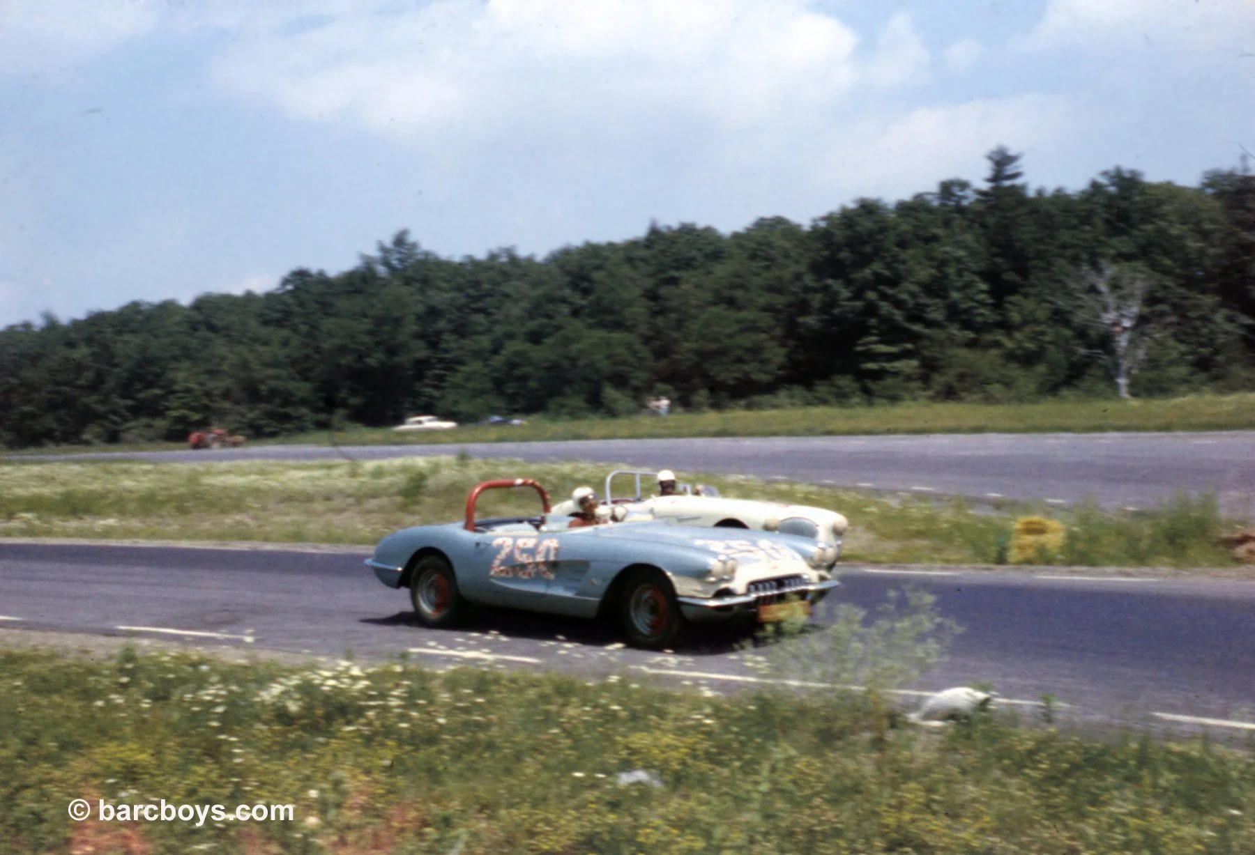  Hal Keck slides inside an Austin Healey as he approaches the tight right turn leading down the Loop.  Keck would go on to dominate NE big production racing in his 427 Cobra.  He won BP at the Classic easily. 