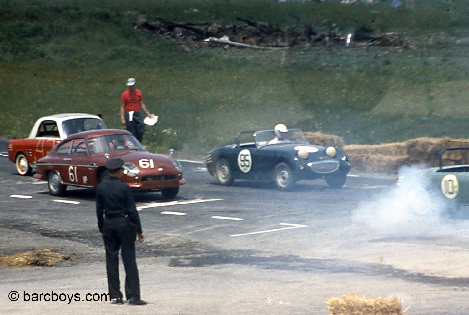  Smoke at the start of the G &amp; H production race.  I can’t remember but my guess is an HM special is spewing 2 stroke smoke rather than smoking the tires. 