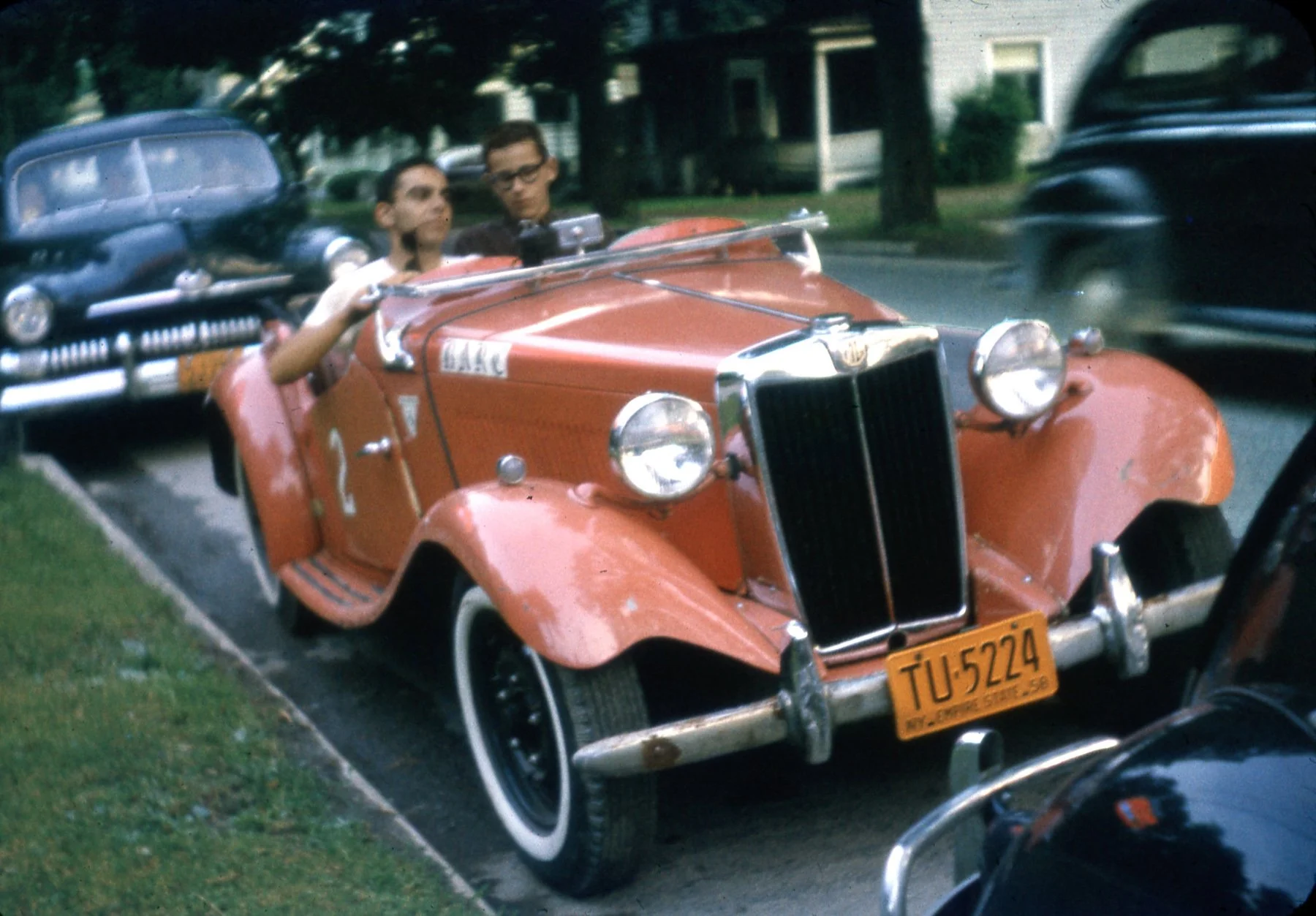  BARC founders Dave Nicholas (L) and Joe Tierno sit in Dave Zych’s pink TD MG.  Note the race #2 on the door and the widscreen down, hub caps off and we are ready to play racer.  Hey it was 61 years ago, there were no smart phones.   