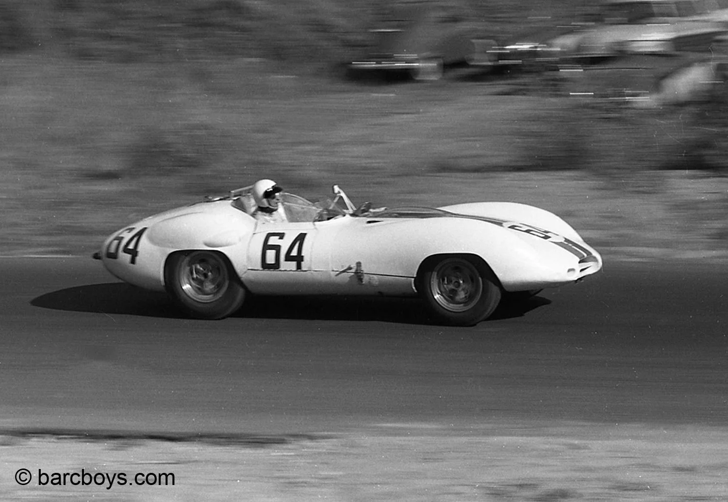  Walt Hansgen in the Costin bodied Lister Cunningham took from its entry at Sebring in March.  The car was bigger than the knobbly Lister but was aerodynamically better.  That made no difference at Lime Rock. 