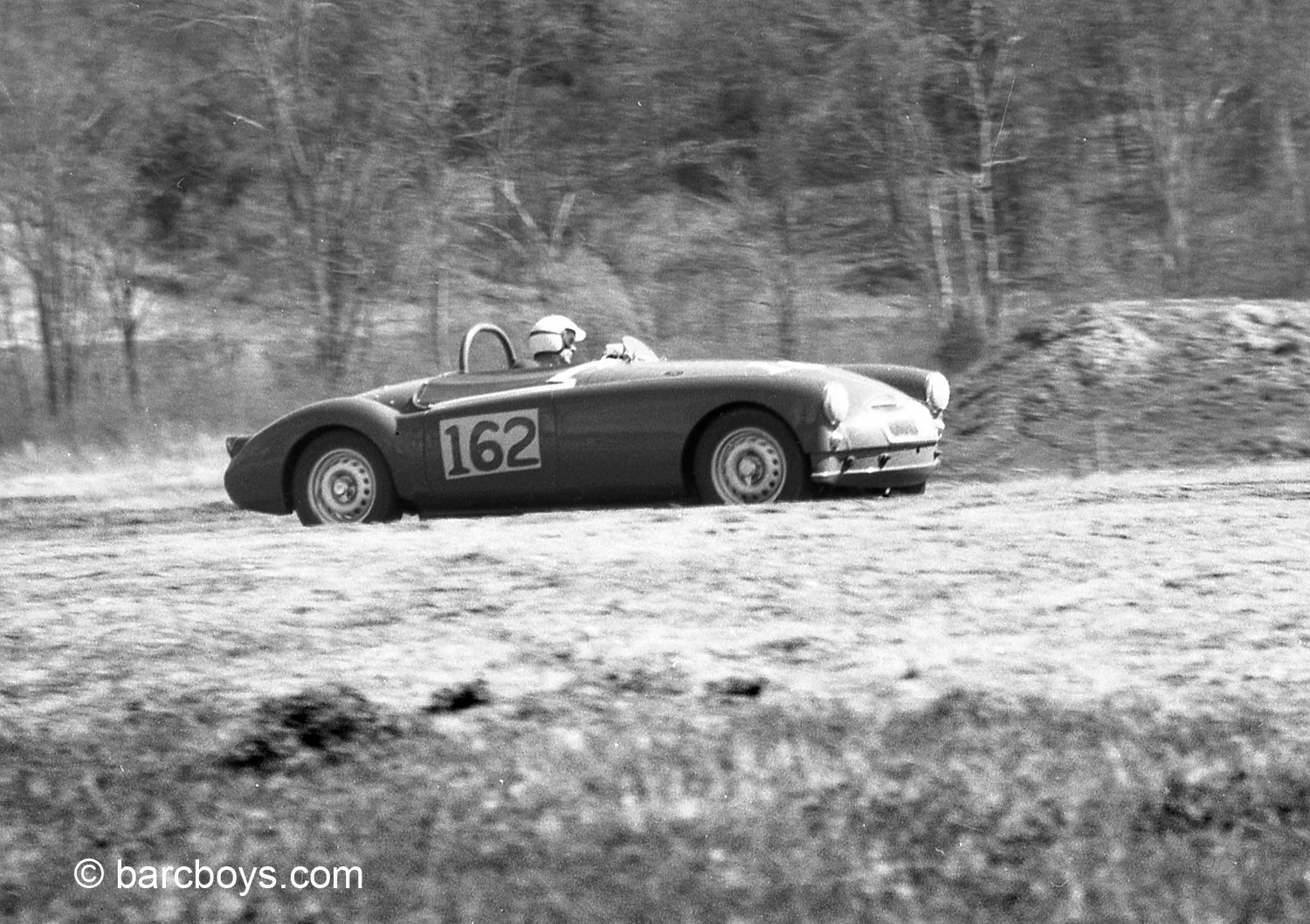  BARC driver Sherm Decker in his red twincam MGA.  Decker was so quick in the car he would scare and often bear Porsche Carrera’s and AC Bristols at Lime Rock.  But the problematic twincam gave up and Sherm was a DNF 