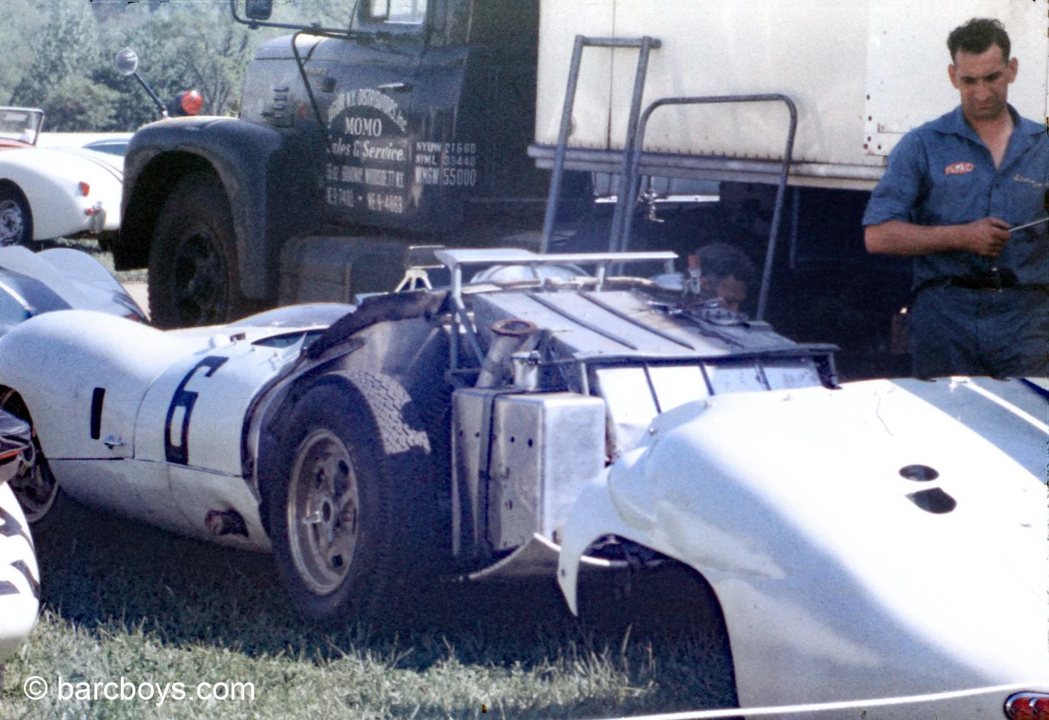  One of Momo’s long time mechanics from Italy works on the Costin Lister.  A rare look at the huge fuel tank made for Sebring and long distance racing.  No fuel cells in 1959 