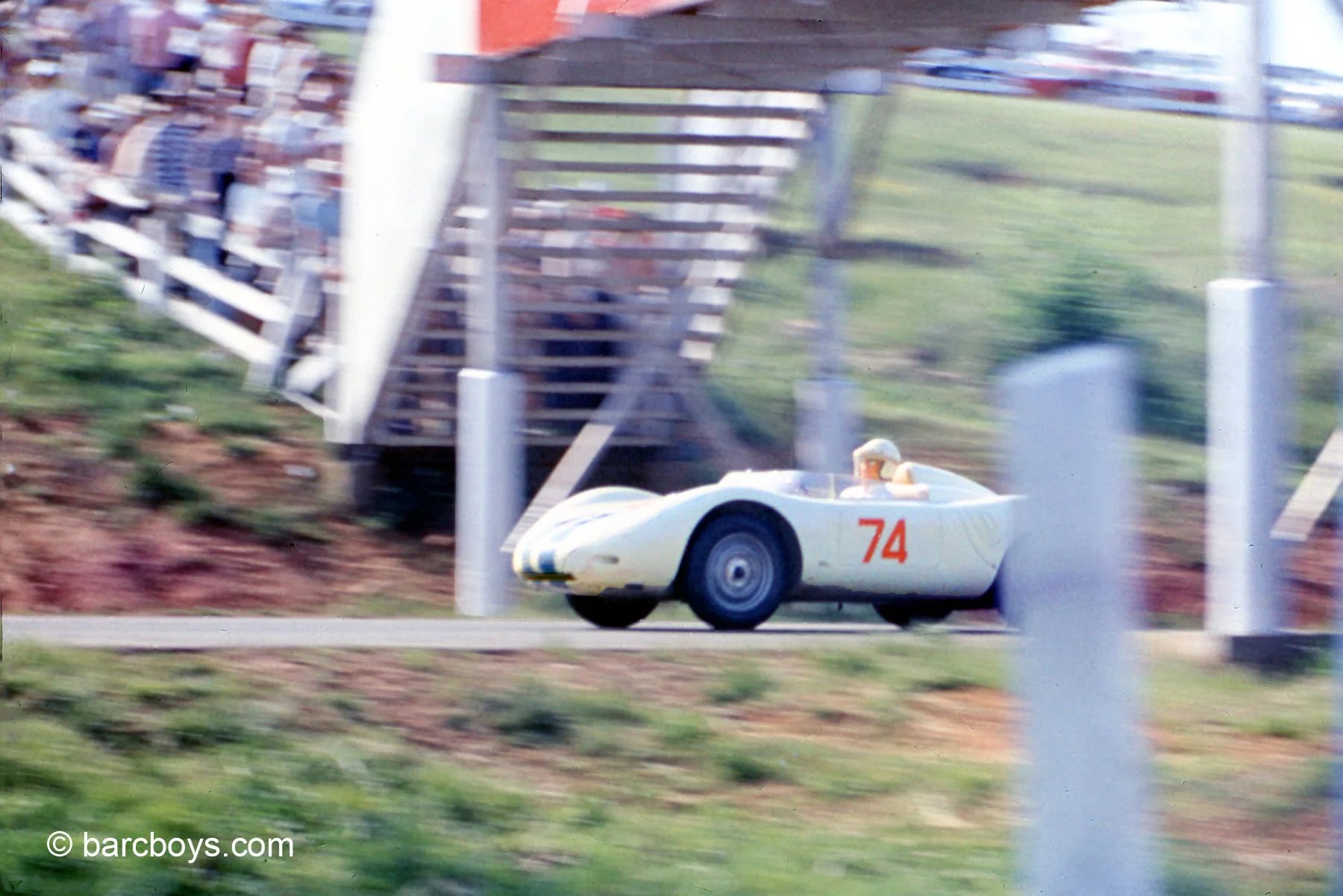  Sessler races beneath the original bridge over the esses.  That series of corners is among the most challenging in the US.  Spectators still sit on the bank and watch though the bridge is long gone. 