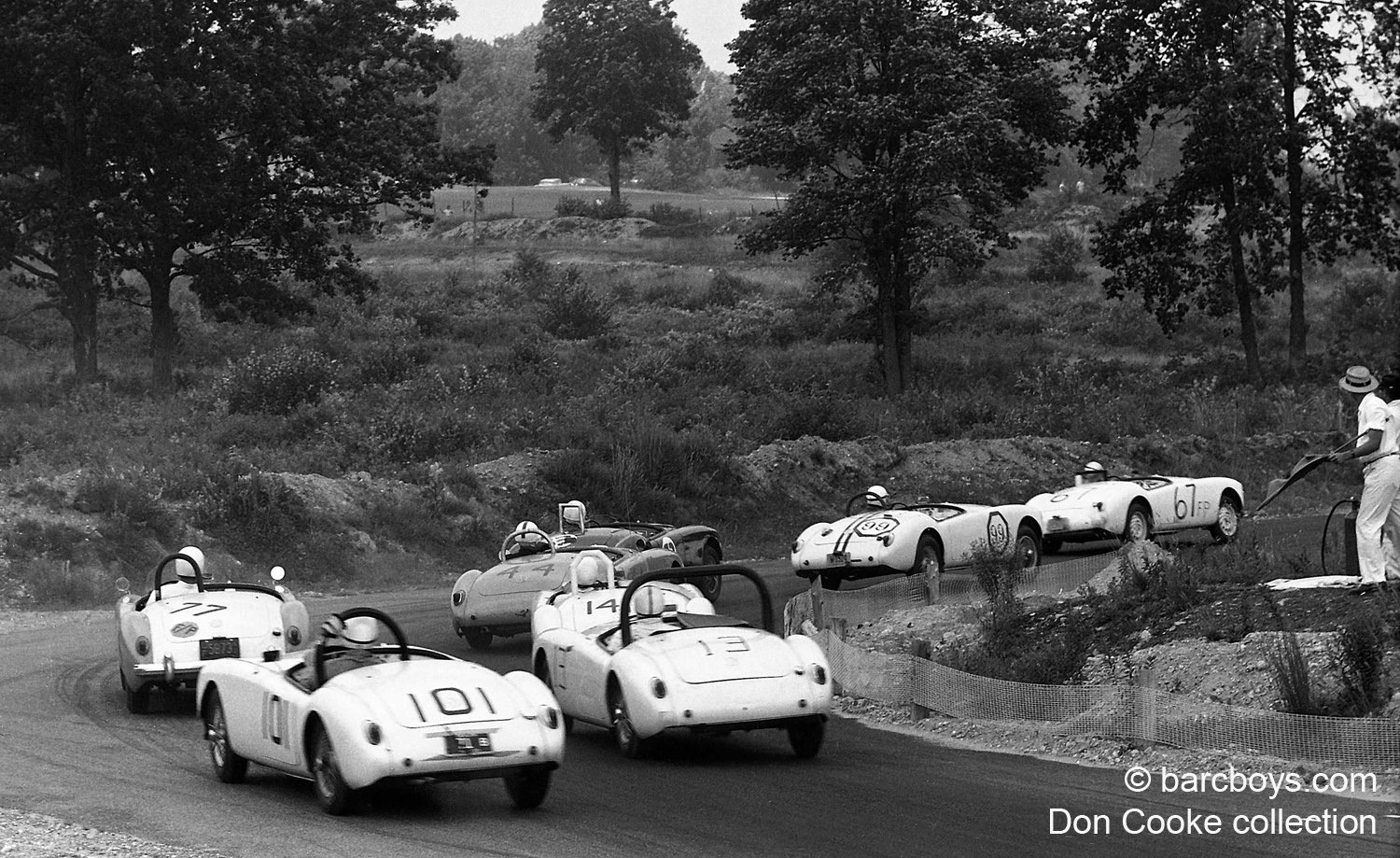  Another look at what racing in 1959 at Thompson looked like.  Eight MGA’s are fighting it out.  Roll bars had just recently been made mandatory.  Not one of the 8 identical cars have the same roll bar.   