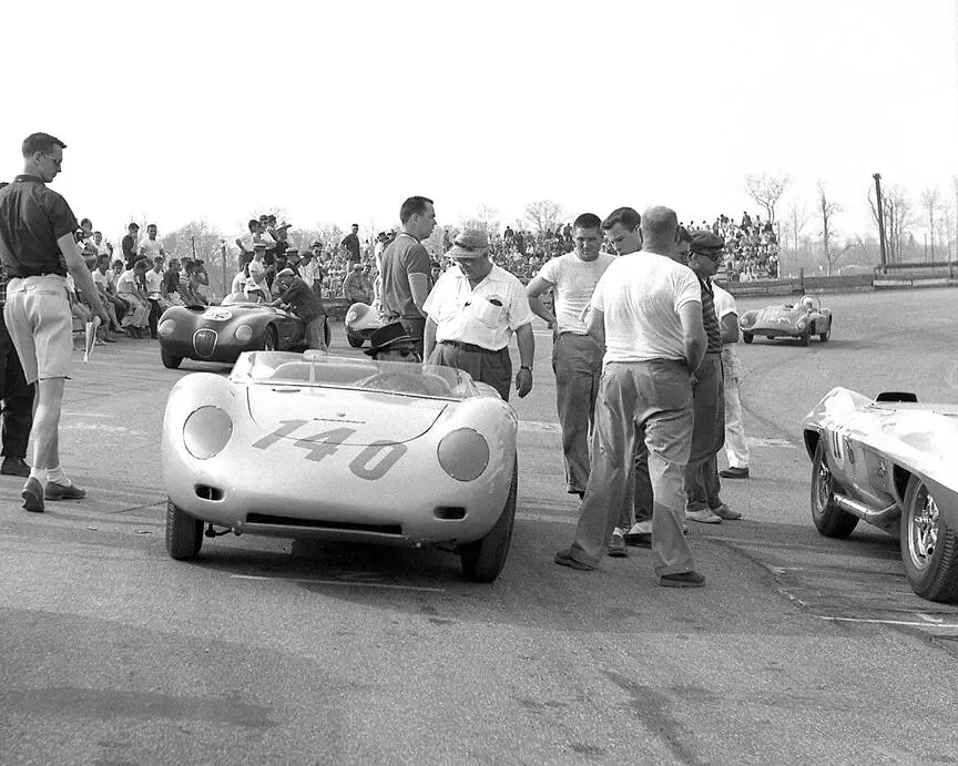  Early on the grid,  Holbert’s car is waiting for Bob to take his seat. 