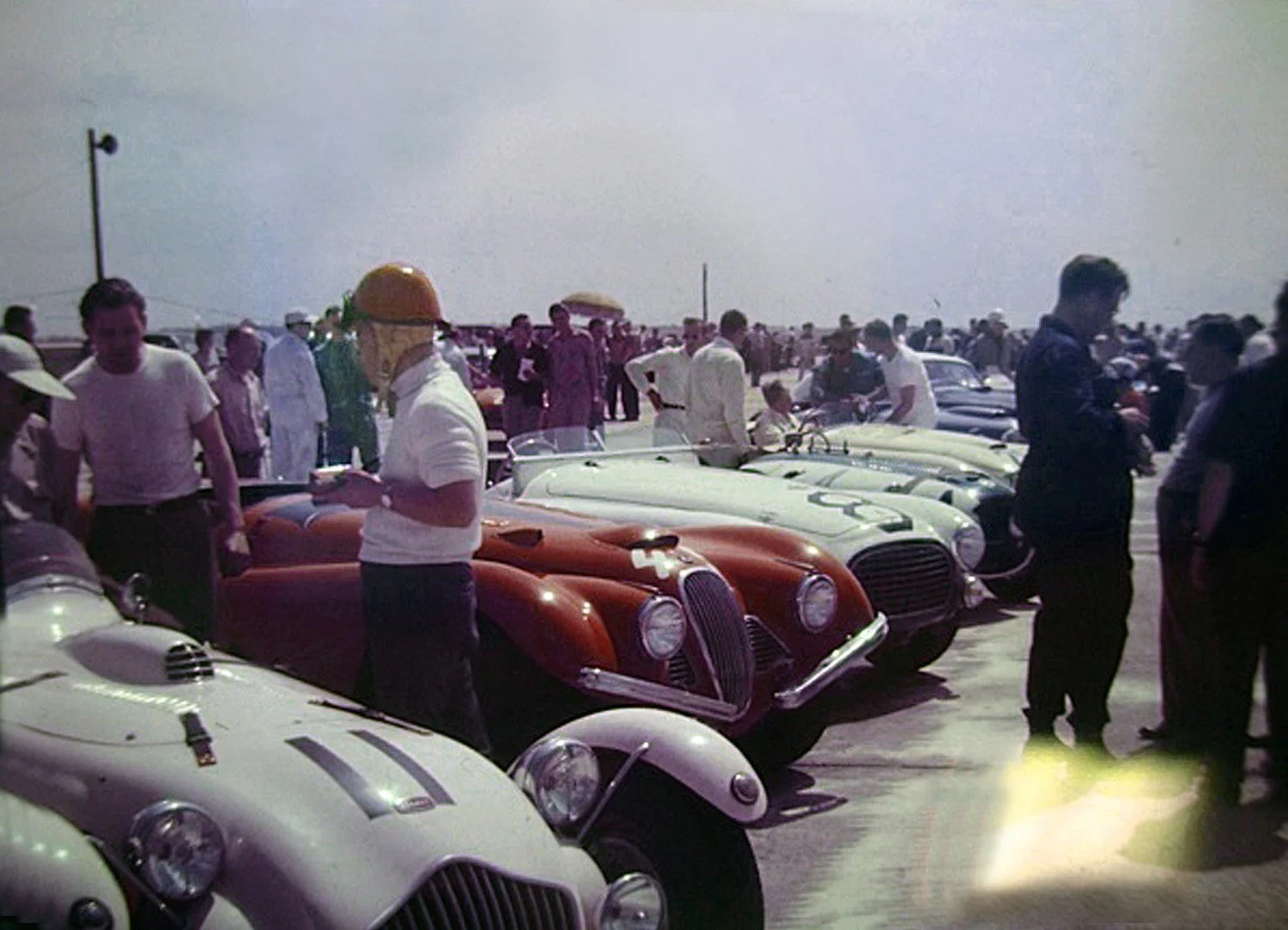  1952: A close look at the grid.  The Grier-Collins Allard lasted abput half of the 12 hours, the red Jag of McDonald-Kennedy was also a dnf when it crashed over some hay bales despite its special air vents and bumpers.  You can see the front of the 