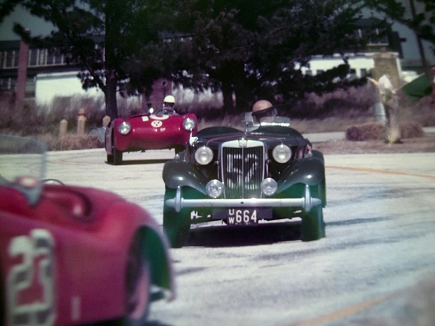  1952: We get a glimpse of the red #23 Jag that finished 2nd leading Walt Hansgen in his #52 MGTD. The red VW special of the Brundage brothers finished 11th just behind Hansgen.  The Brundage family went on to start Brumos Porsche. 
