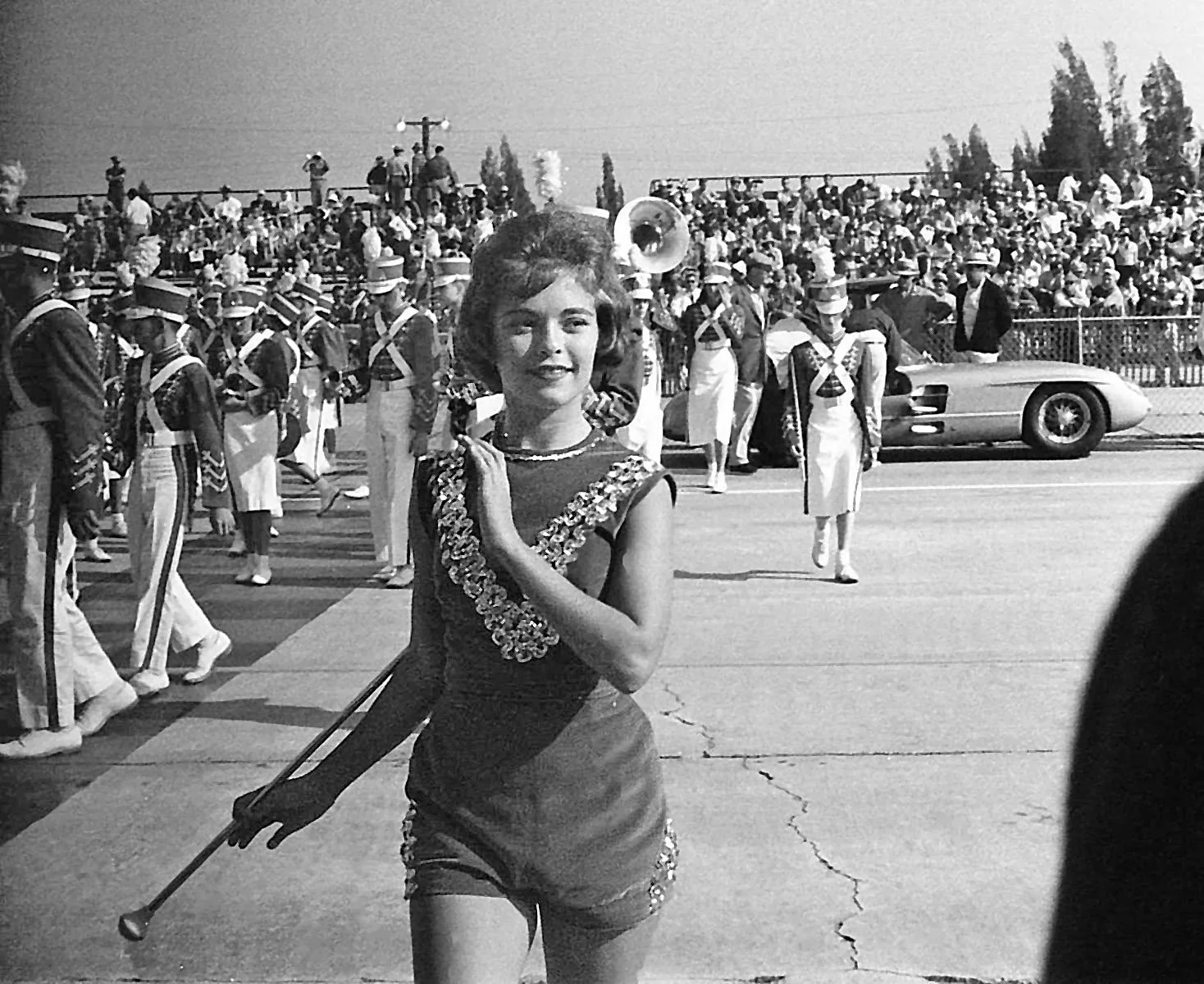  1962:  Every year the Sebring high school marching band would perform just before the start.  As young men from the frozen north we simply had to take photos of cute baton twirlers. 