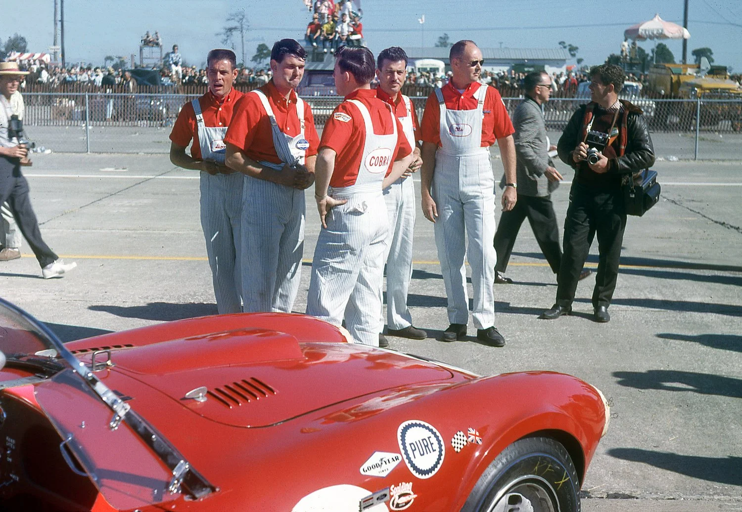  1963:  Shelby was out in force with his Cobra’s.  The crew decked themselves out in striped bib overalls as a tribute to Shel who wore overalls in his early racing days.  Yep, Ol’ Shel wore a pair himself. 