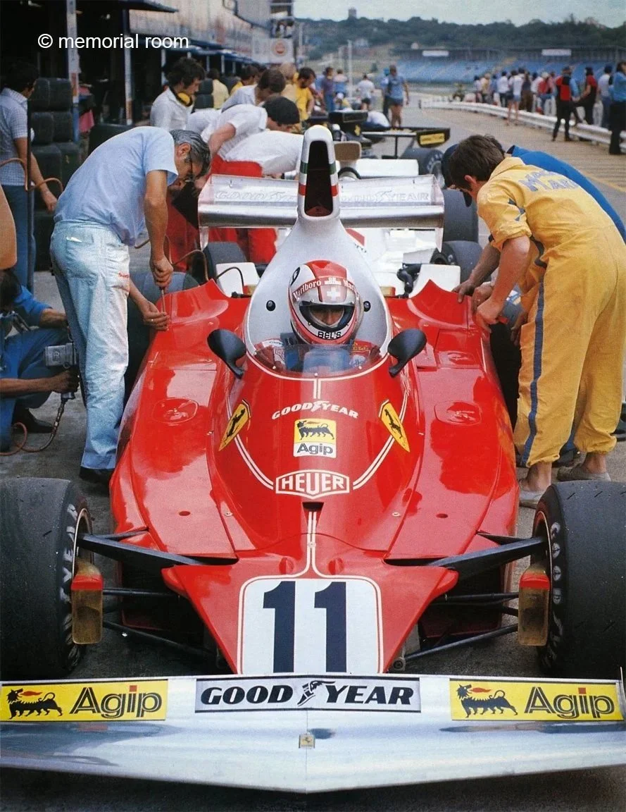  1975.  Driver Clay Regazzoni, Giulio Borsari on L, Engineer. Ferrari 312T 