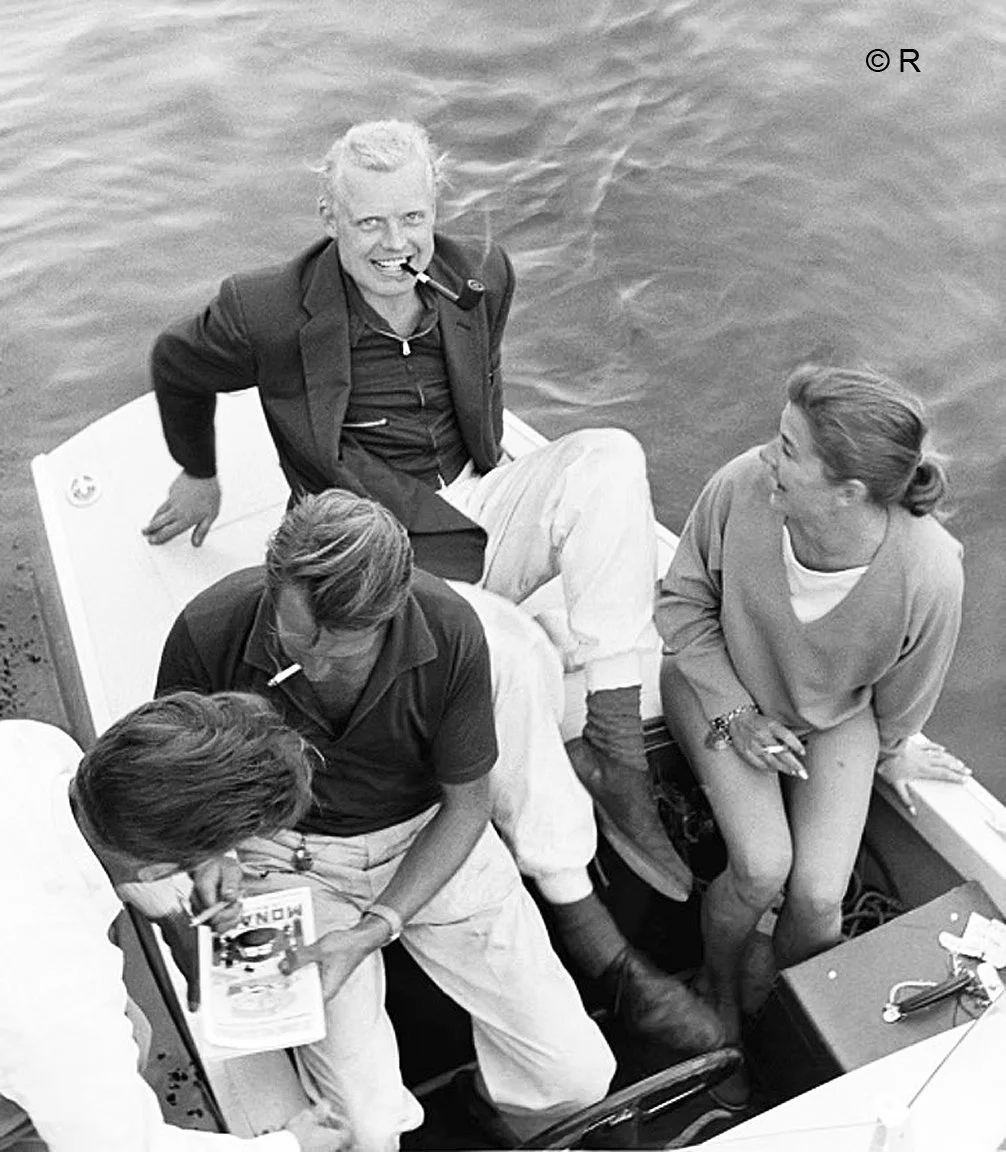  What else is there to do in Monaco before the race?  Go for a ride in Peter Collins skiff.  With him are the lovely Louise Collins and teammate Mike Hawthorne. 