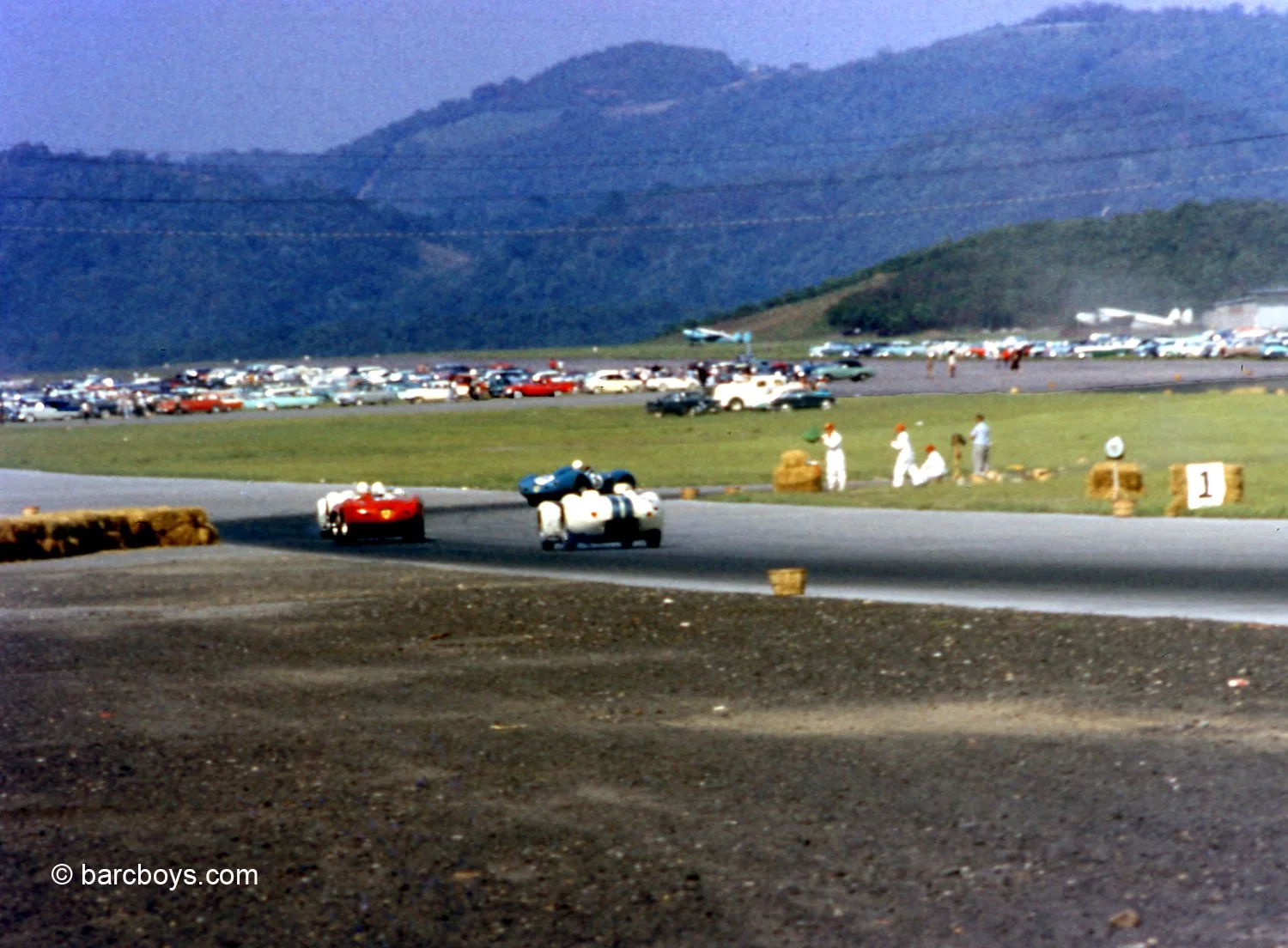  A terrific view of what Cumberland looked like.  Here, Hansgen’s Lister chases Johnston’s Ferrari with Gus Andrey’s blue Ferrari 550TR leading.  This could have been in practice or as the Lister’s were lapping traffic. 