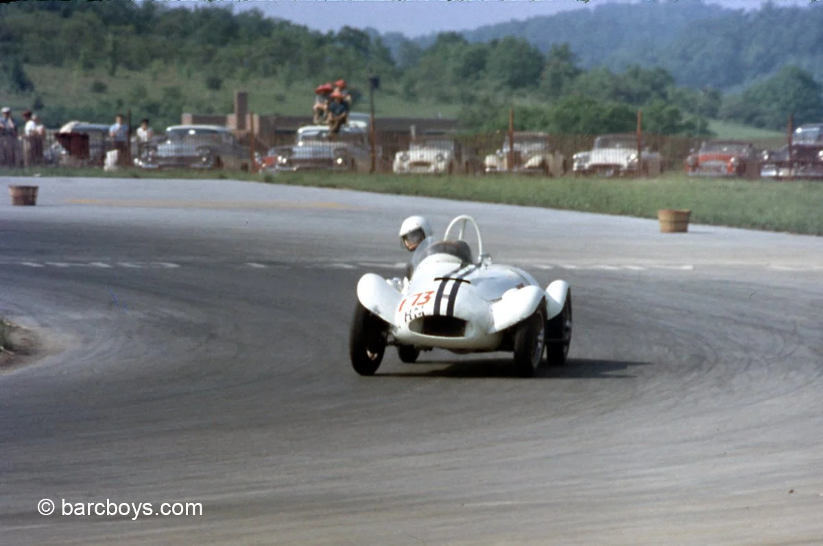  A Bandini driven by Jim Eichenlaub won the H Modified class.  This Bandini driven by George Parsons was a DNF.  Note the TR, MG-TD, Vette and MGA behind the fence.  A reported 40,000 came to see the Cumberland races in 1958. 