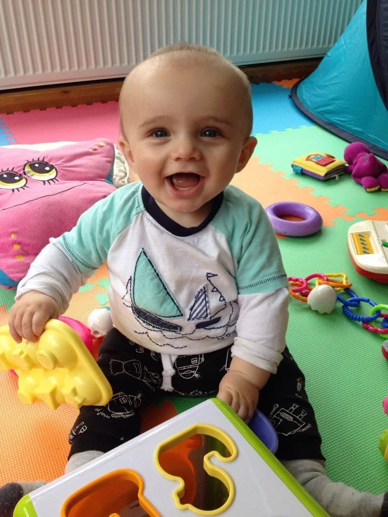 The photo the childminder sent me on his first full day