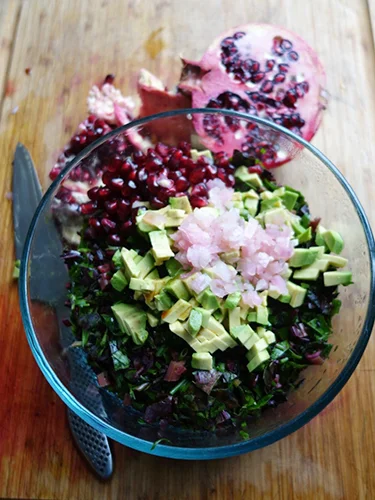 Scrunch the beetroot leaves in your hands to soften them then chop them finely. Add a firm avocado chopped small as well.