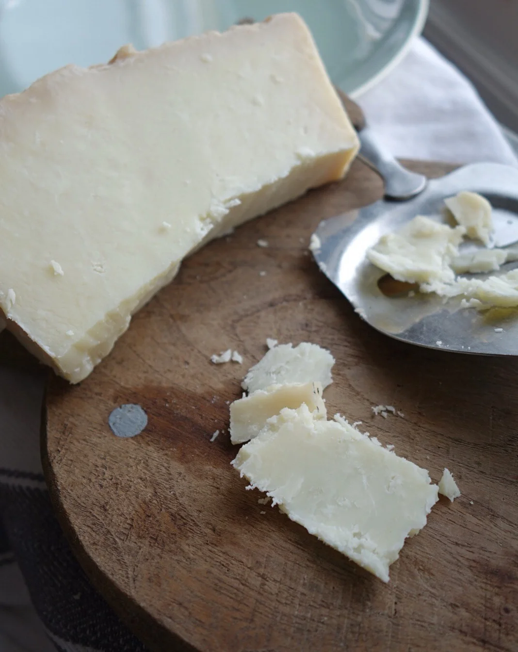 Choose a gorgeous hard cheese. I found this one at a beautiful Greek shop on Myddleton Road I think it was goat or sheep, really sharp and flavourful. I made a quick dressing of a few chunks of this, lemon , olive oil and a few tbsp of kefir ( I make mine it is super easy with organic milk delivered in glass and Nourish kefir kits I find at my local Planet Organic ), a small piece of garlic, another glug of olive oil, juice of half a lemon, and a spoonful of tahini ( I like Cypressa organic ). Whiz it in a blende r and after arranging the veggies pour over and top with the crumbled cheese.