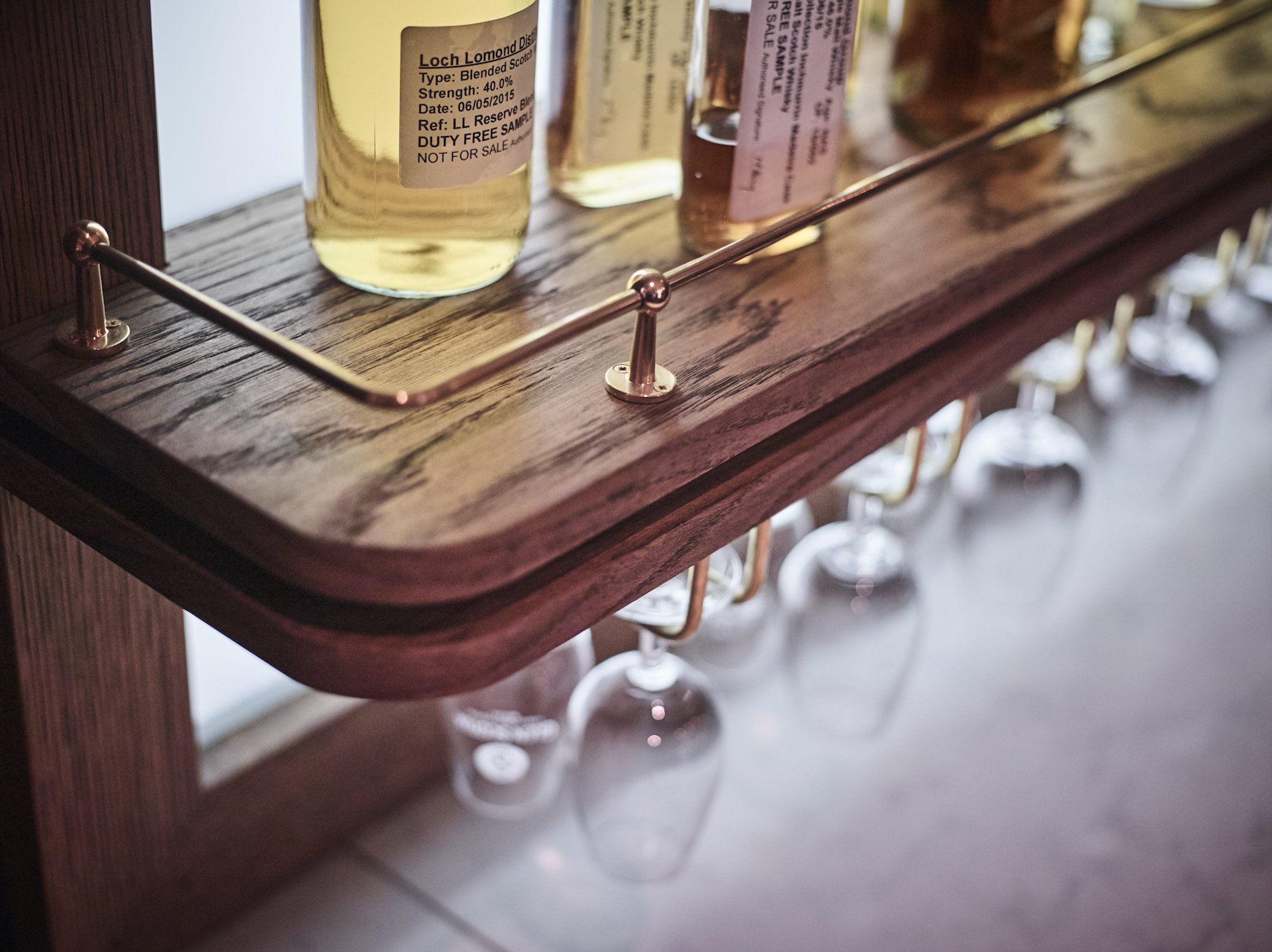 James Strong Tasting Room Single Sample Bottle Shelf Detail.jpg