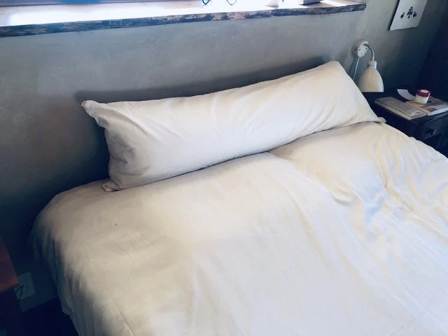 Body pillow on bed-cool.jpeg