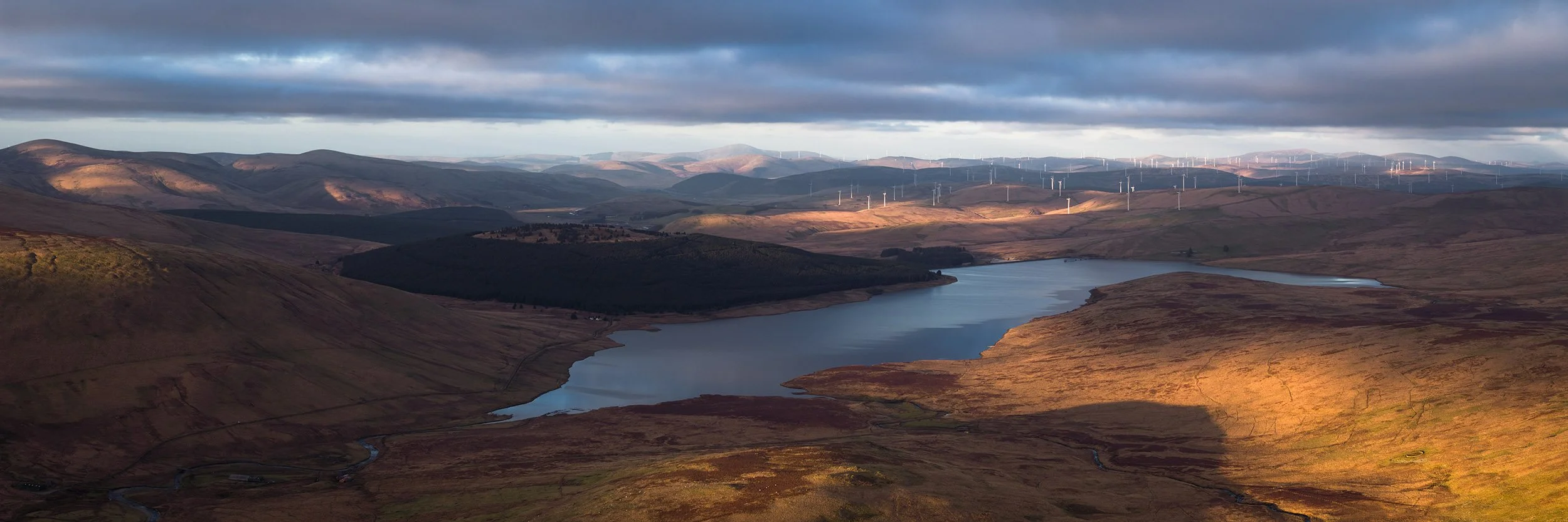 Daer Reservoir with the Clyde Wind Farm in the distance.