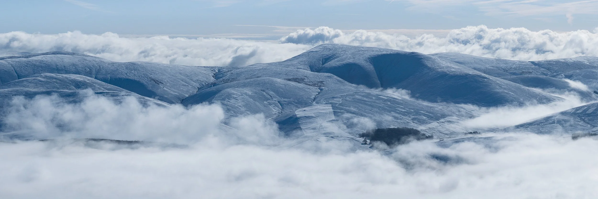 Culter Fell surrounded by early morning mist.