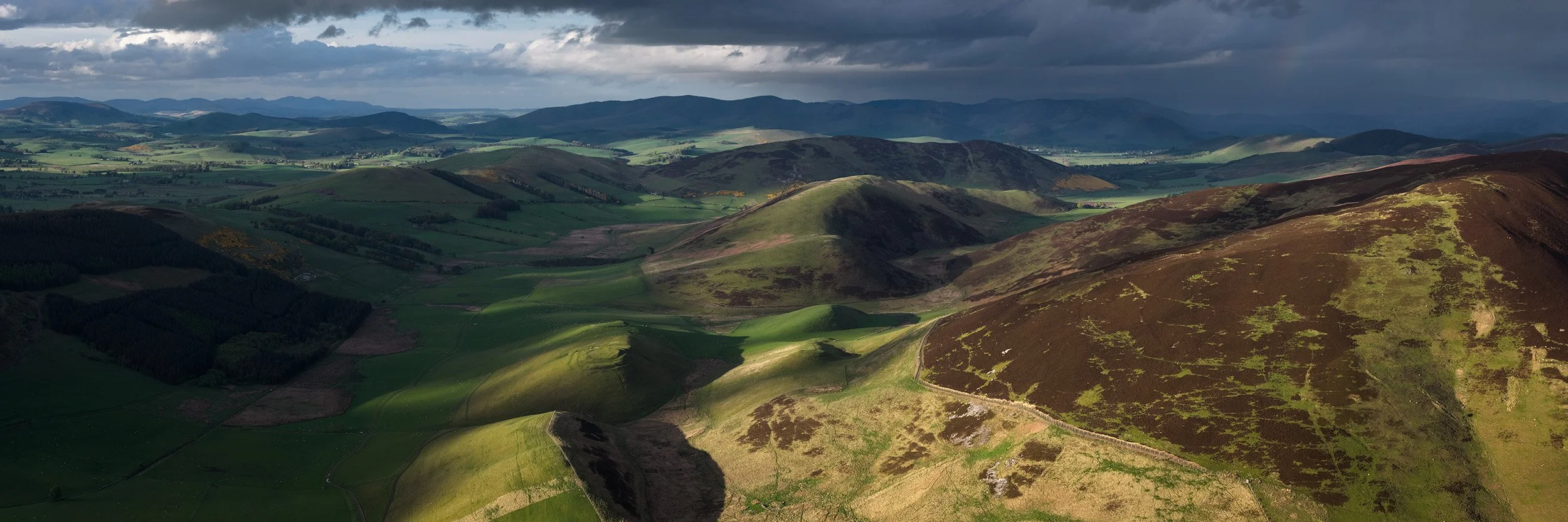  This beautiful valley contains many ancient hill forts and historic settlements including Cow Castle which is clearly visible on the small hill in the centre of the picture. 