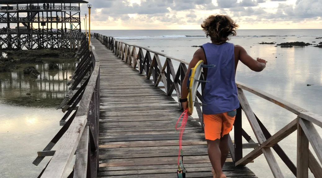 Cloud 9 where surfers jump off the pier to catch early morning waves. By Beverly Rose