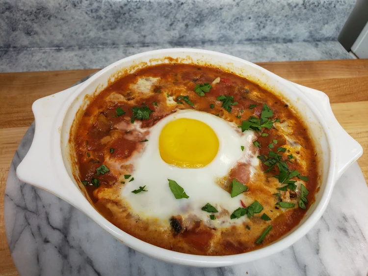 bowl of shakshouka on a table 