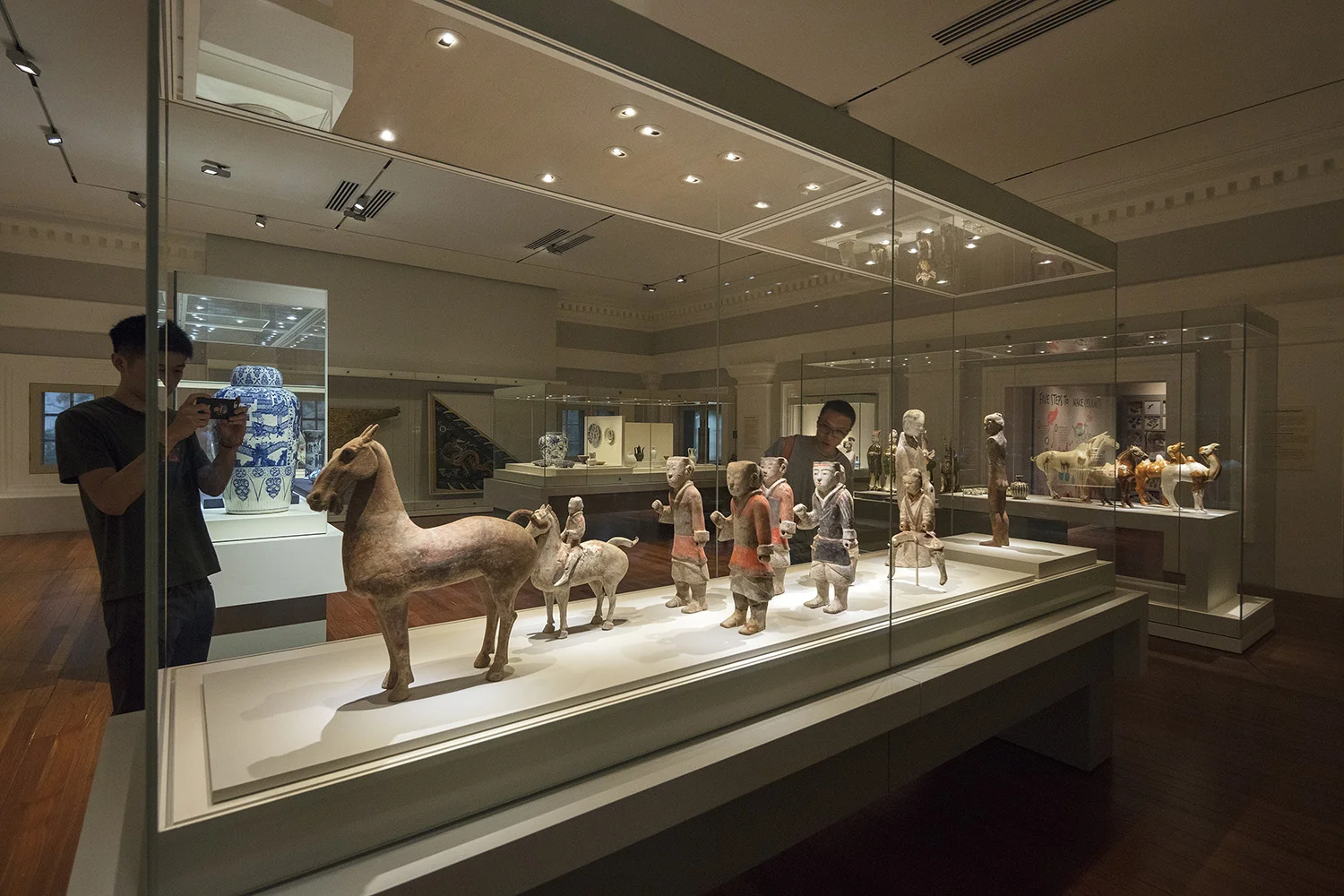 Artefacts are showcased in custom cases and tailored mounts, with spatial planning and directed lighting ensuring they capture the attention of the visitor.