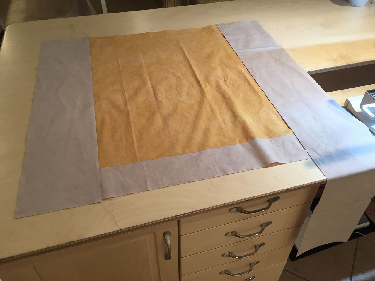 Yellow Square in progress. I never cut borders to exact size. I add an additional inch or two, press, then square up with the rotary cutter.