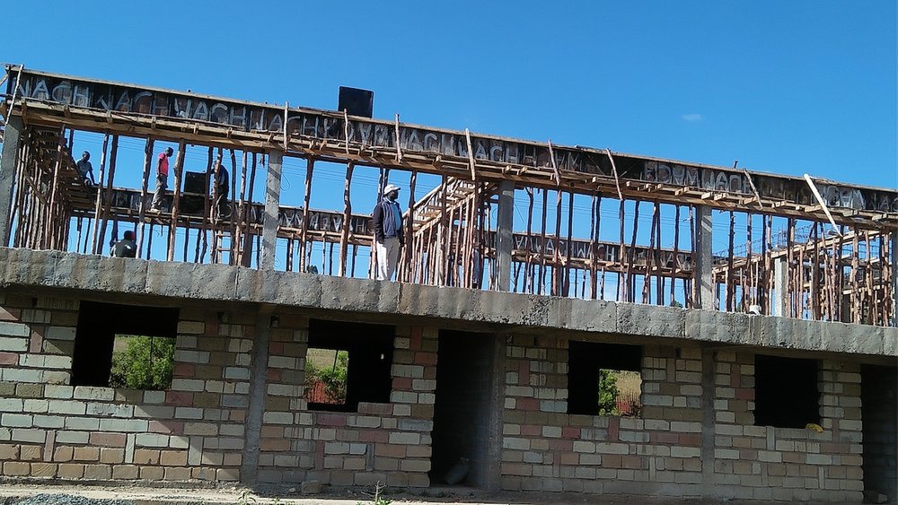 Richard stands beneath the second floor forms