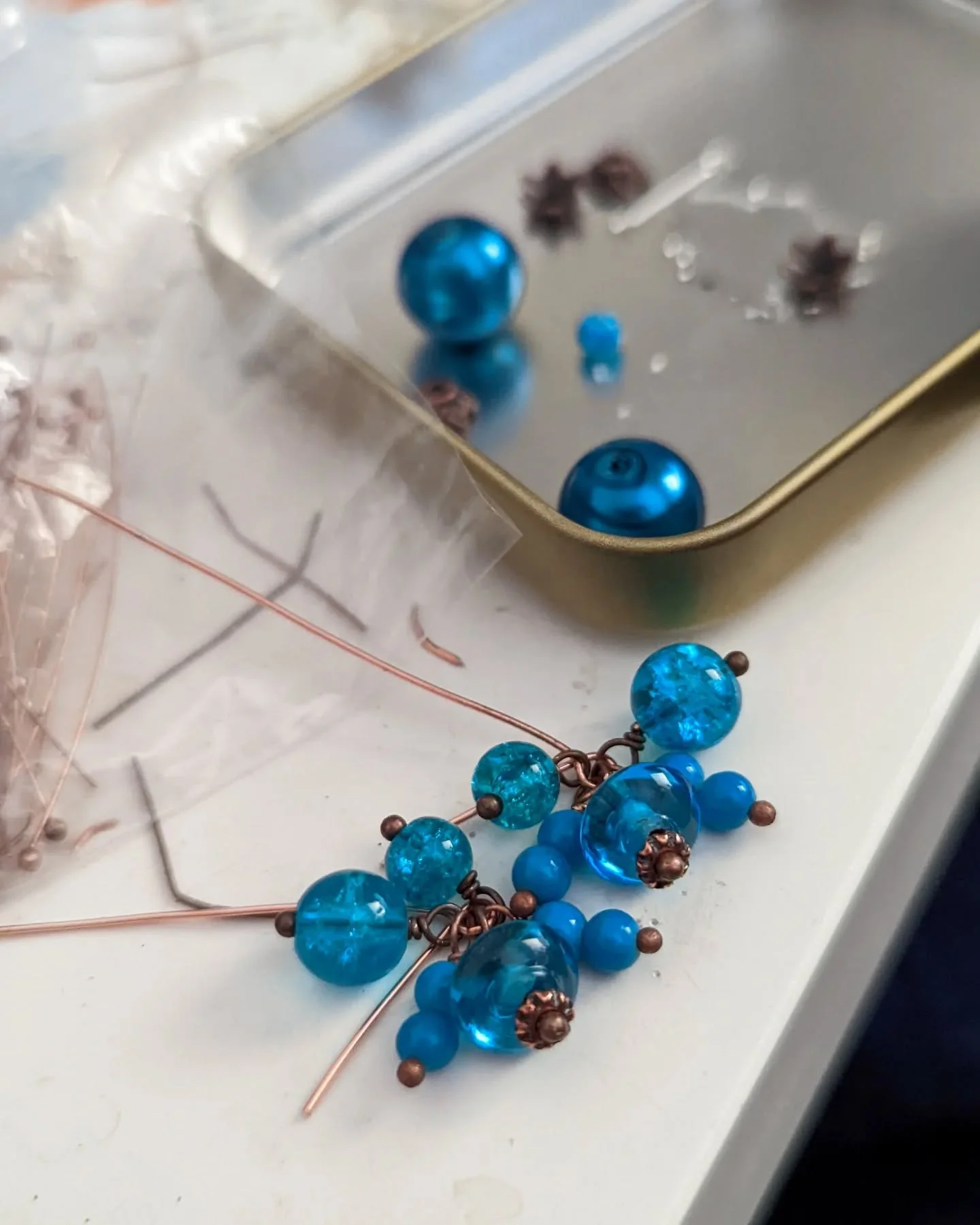 Froth of the Sea earrings, back when they were being made. This blue is a pain to edit in photos!! But gosh, what a color. And all the little beads to make the froth! So cute!