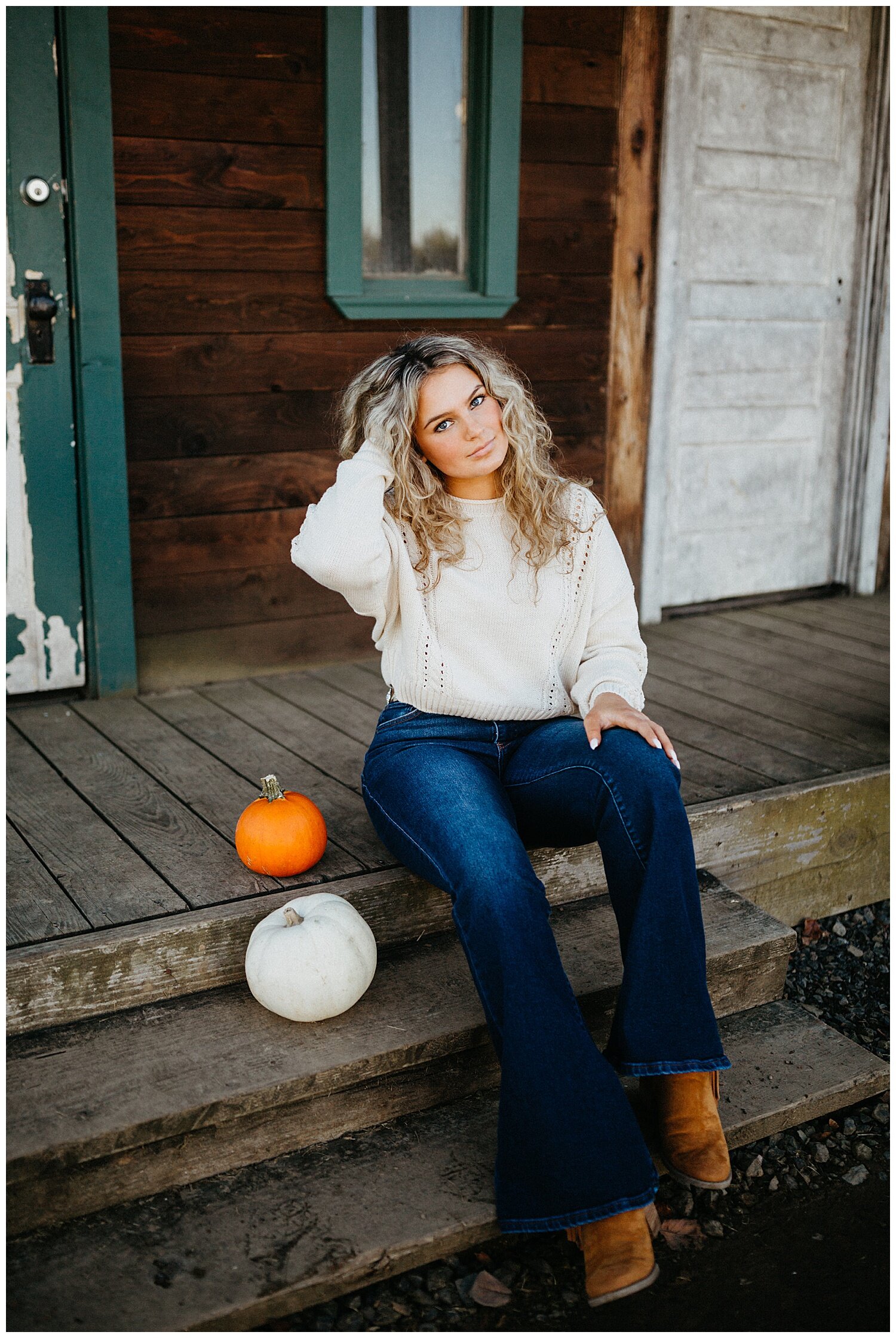  Girl sitting next to pumpkins for her senior portraits in Portland, Oregon by Jasmine J. Photography 