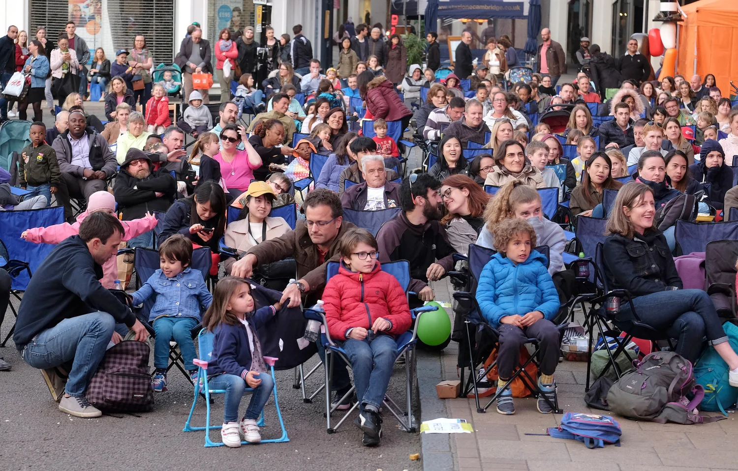 An audience at an earlier Cambridge BID outdoor cinema evening in the city centre