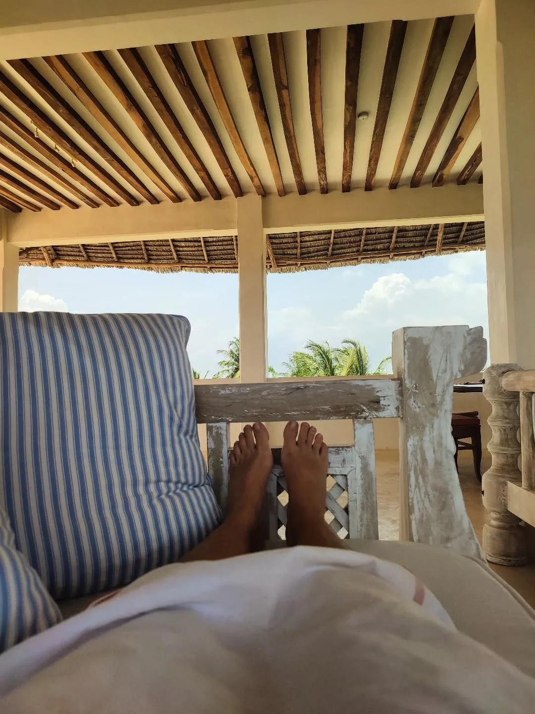 Life is best enjoyed with a cold drink and a good view - in this case, relaxing on our Top Deck sofas and a good book 📚. 

The wind up there makes for a great little spot to chill out and keep cool in the February heat 🌞. 

#coastal #Lamu #beachhou