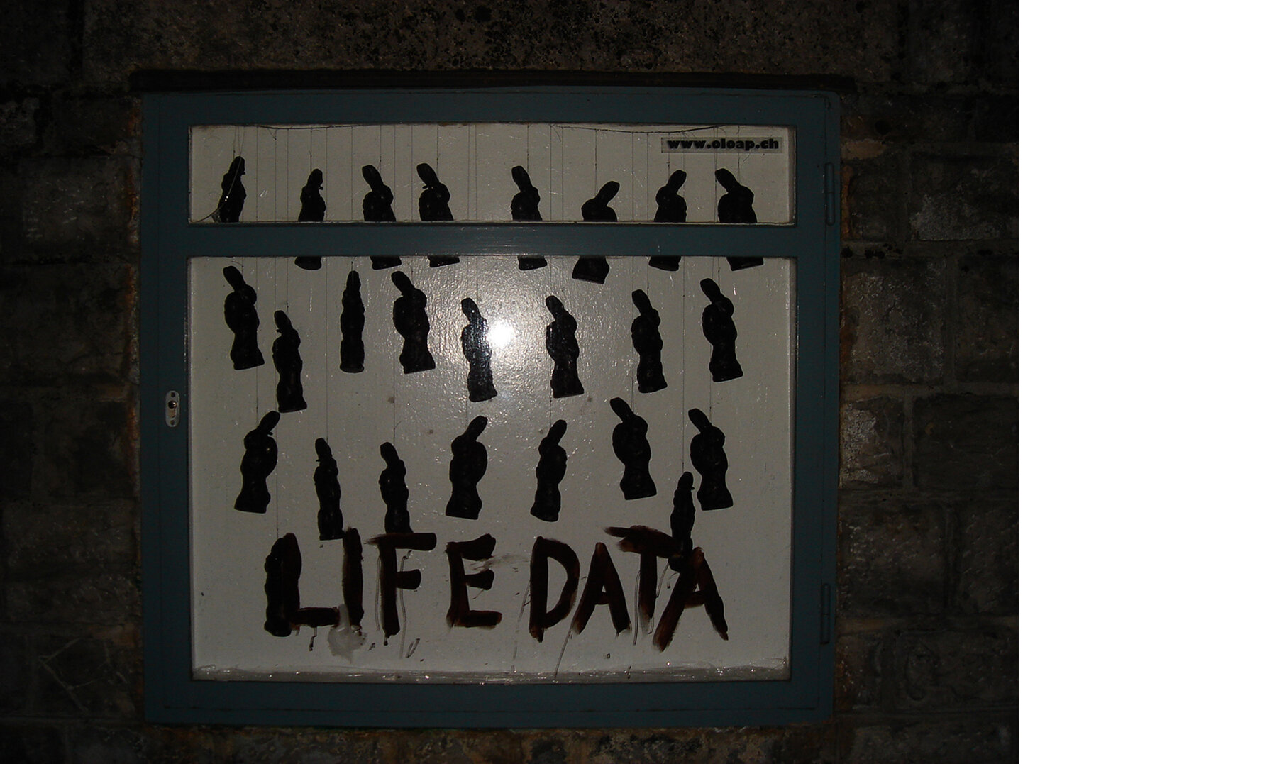   Life data (2007) Loïc Martin   Chocolate, tie and nylon thread. Variable size installation (48,8 x 49,6 x 11,6 inches / 124 x 126 x 29,5 cm) 