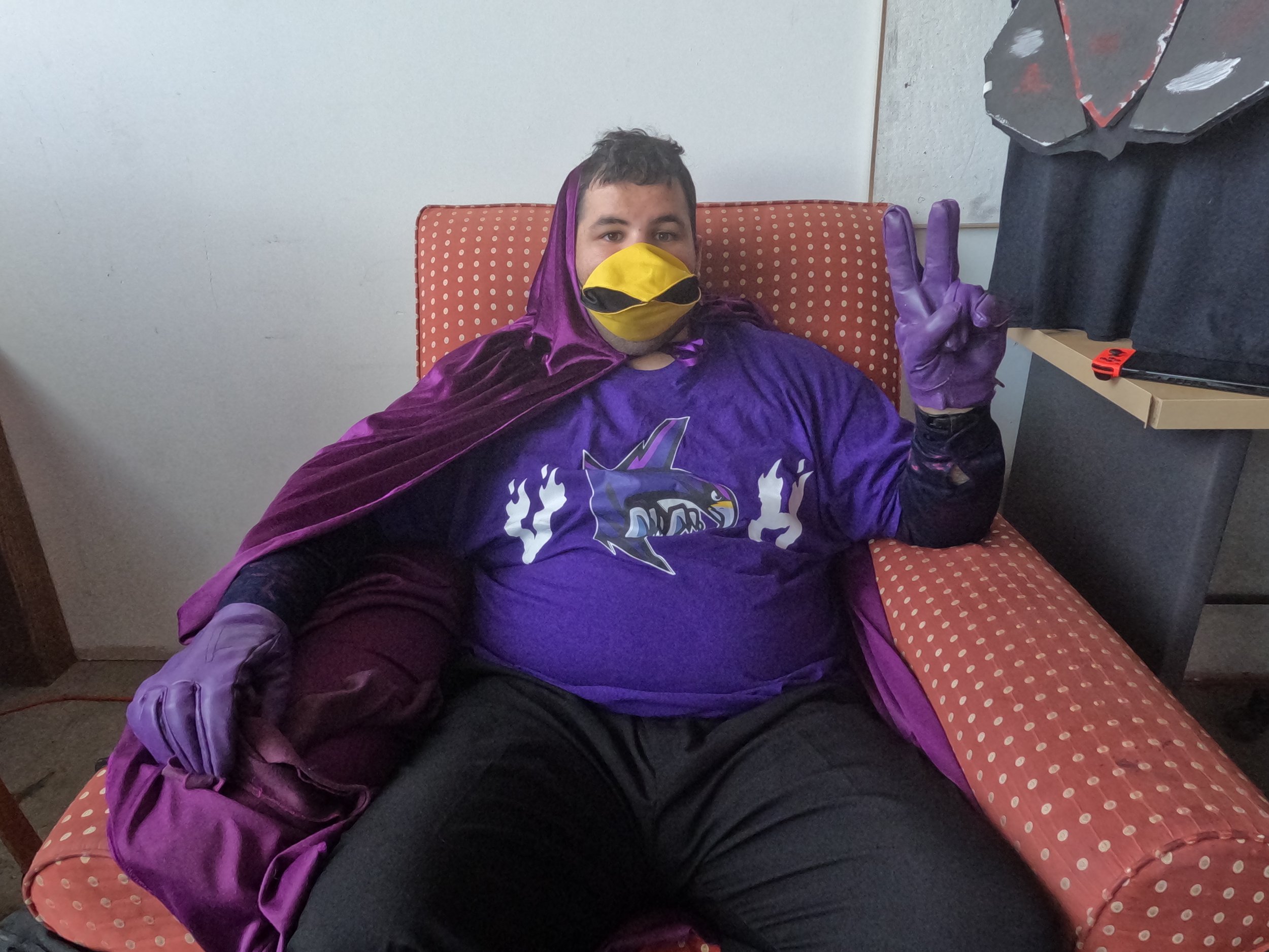 Alex in his hero suit waiting to film