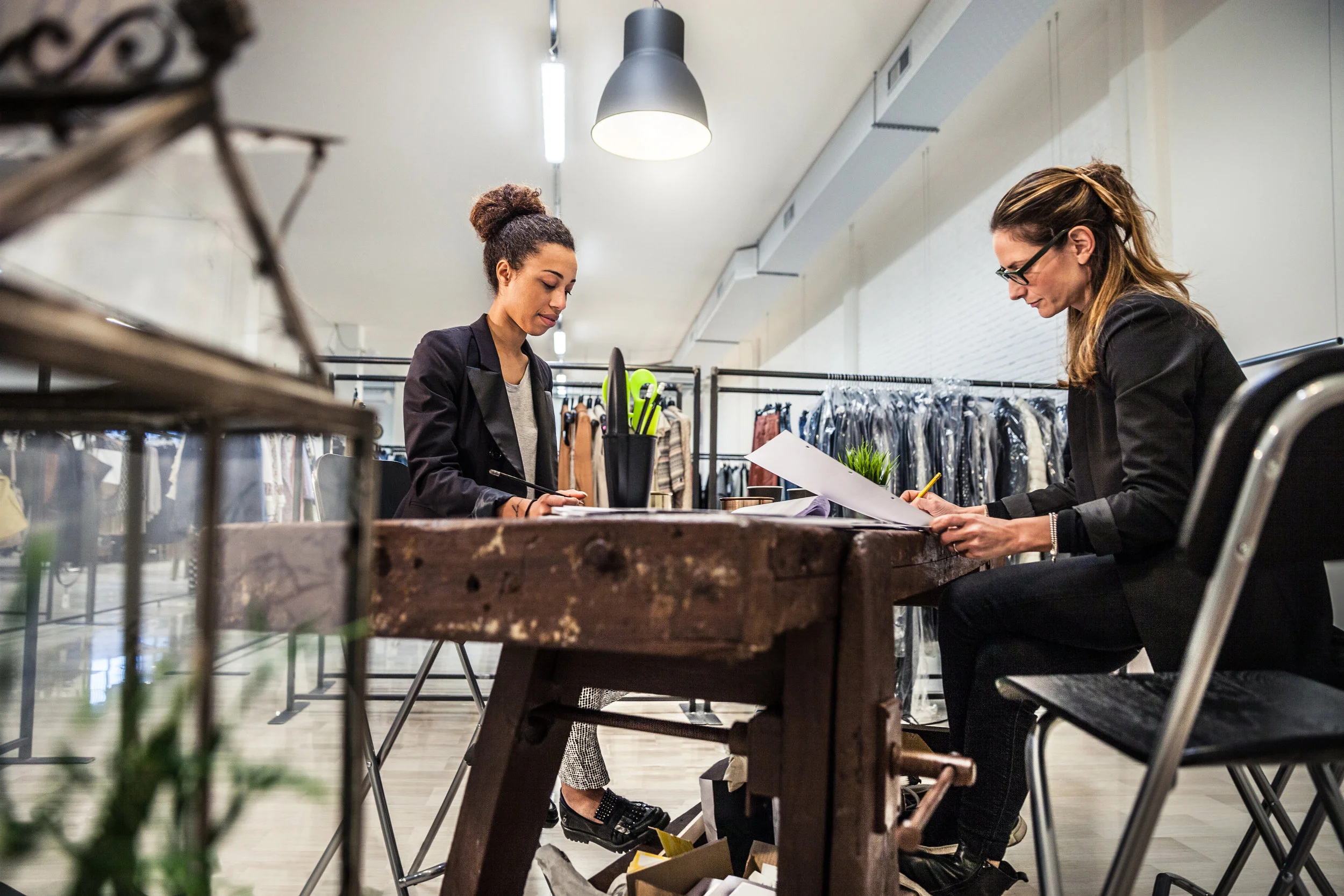 New-Business-clothing-store,-women-at-work-on-contracts-509724030_5616x3744.jpeg