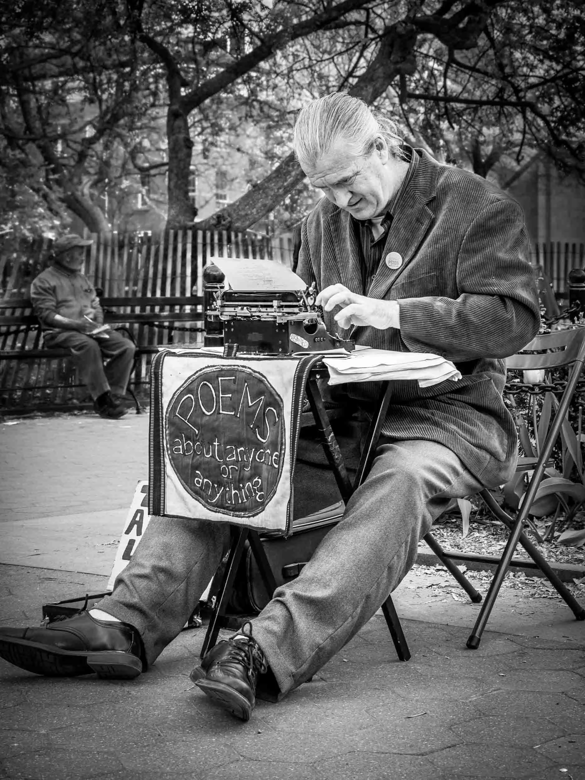 This is a nice memory picture that I took in Washington Square in NYC, but this poem-writing street performer is probably one of the most photographed persons in the United States. Click picture for a larger image.
